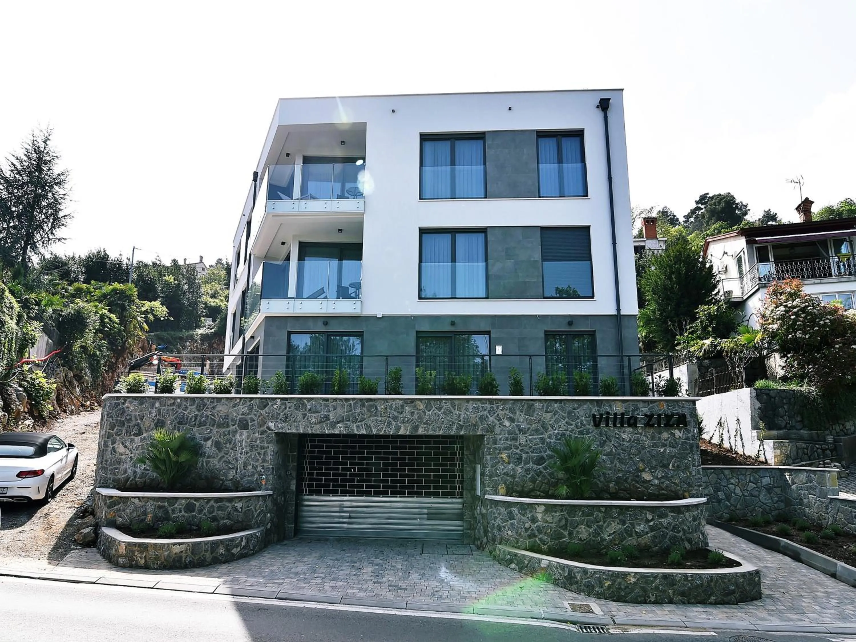 Property building in Apartments in Villa Ziza, rooftop swimming pool
