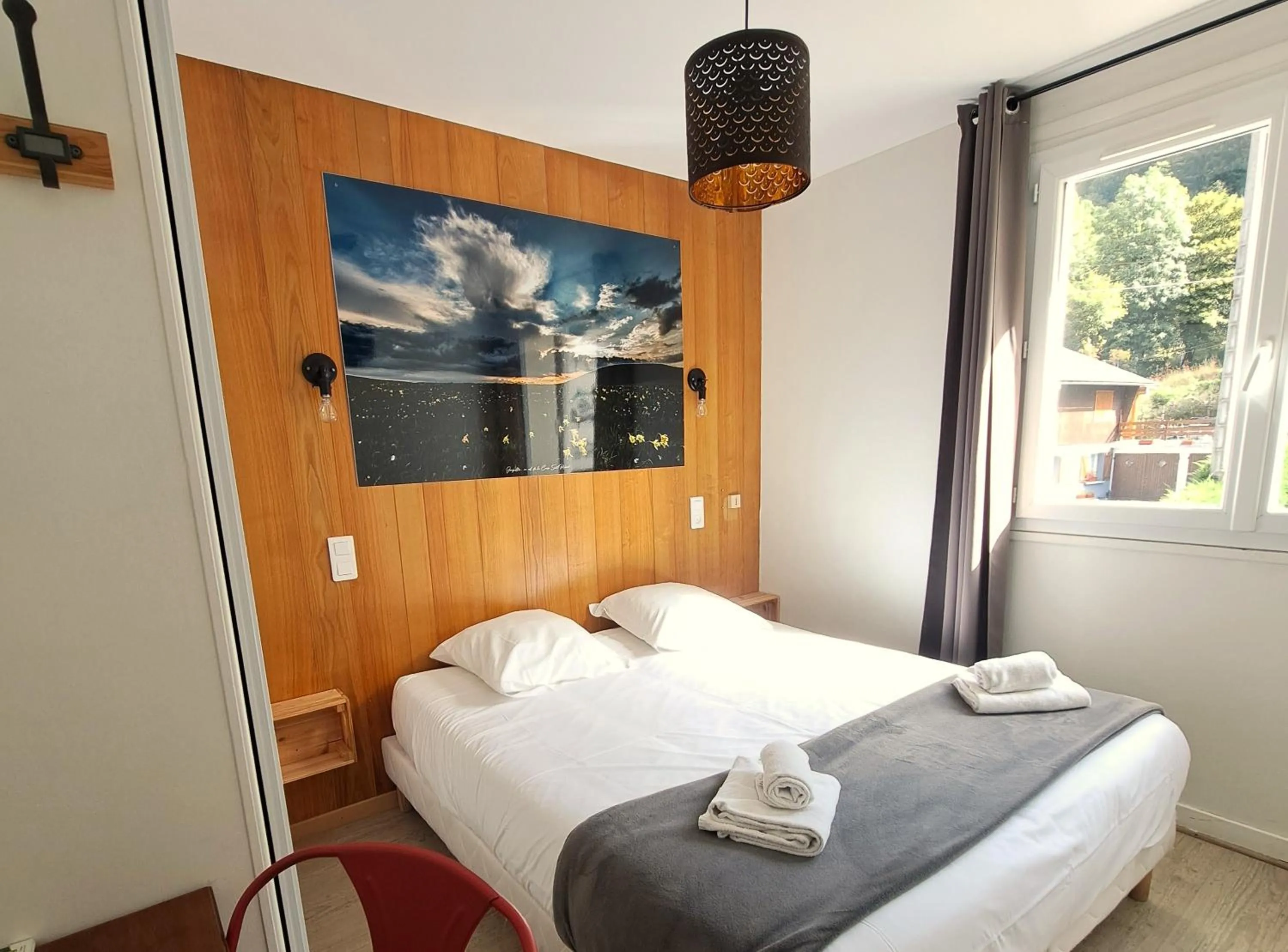 Bed in Hôtel Les Mouflons