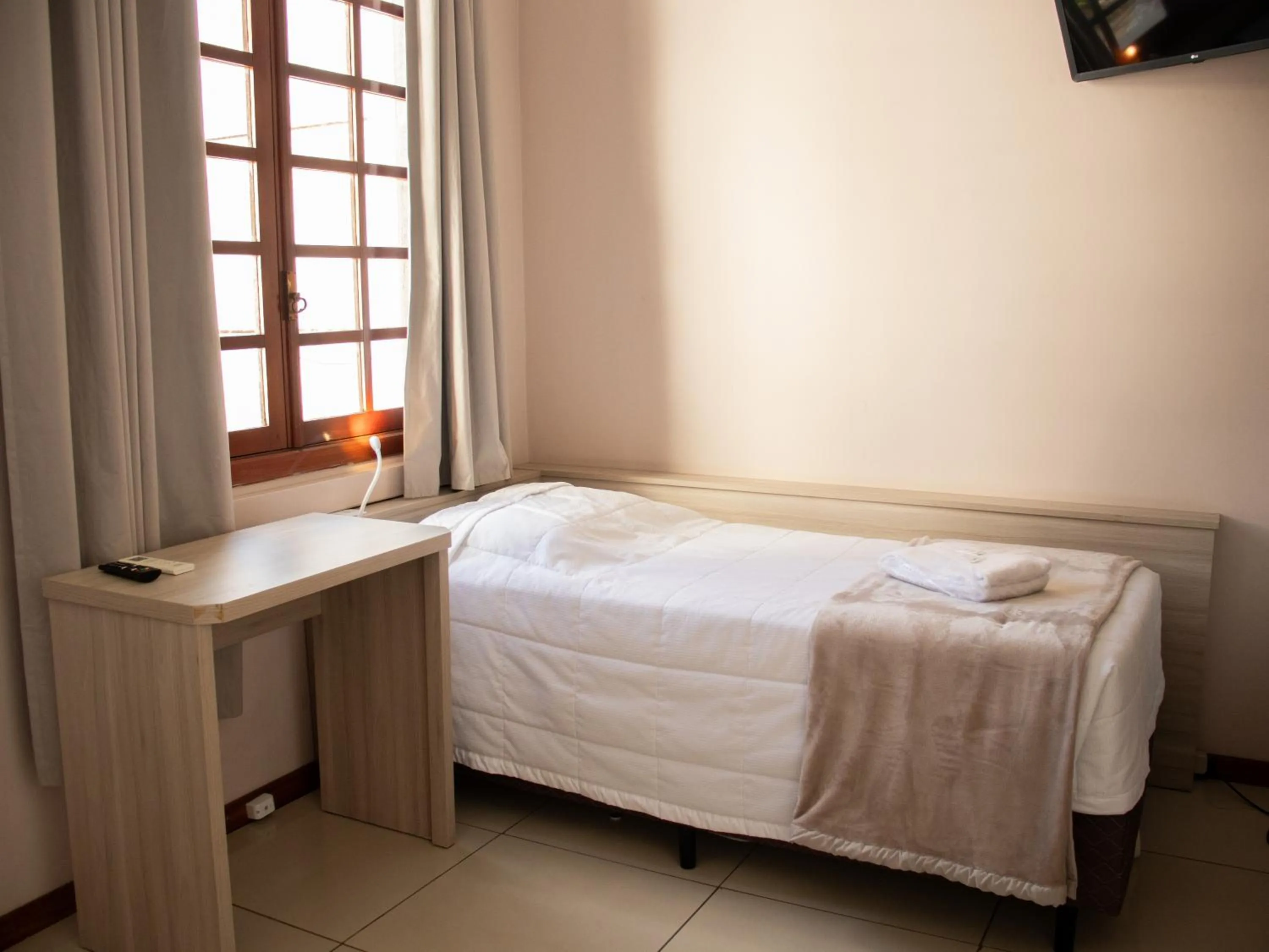 Bed in Hotel Villa Souza Ltda