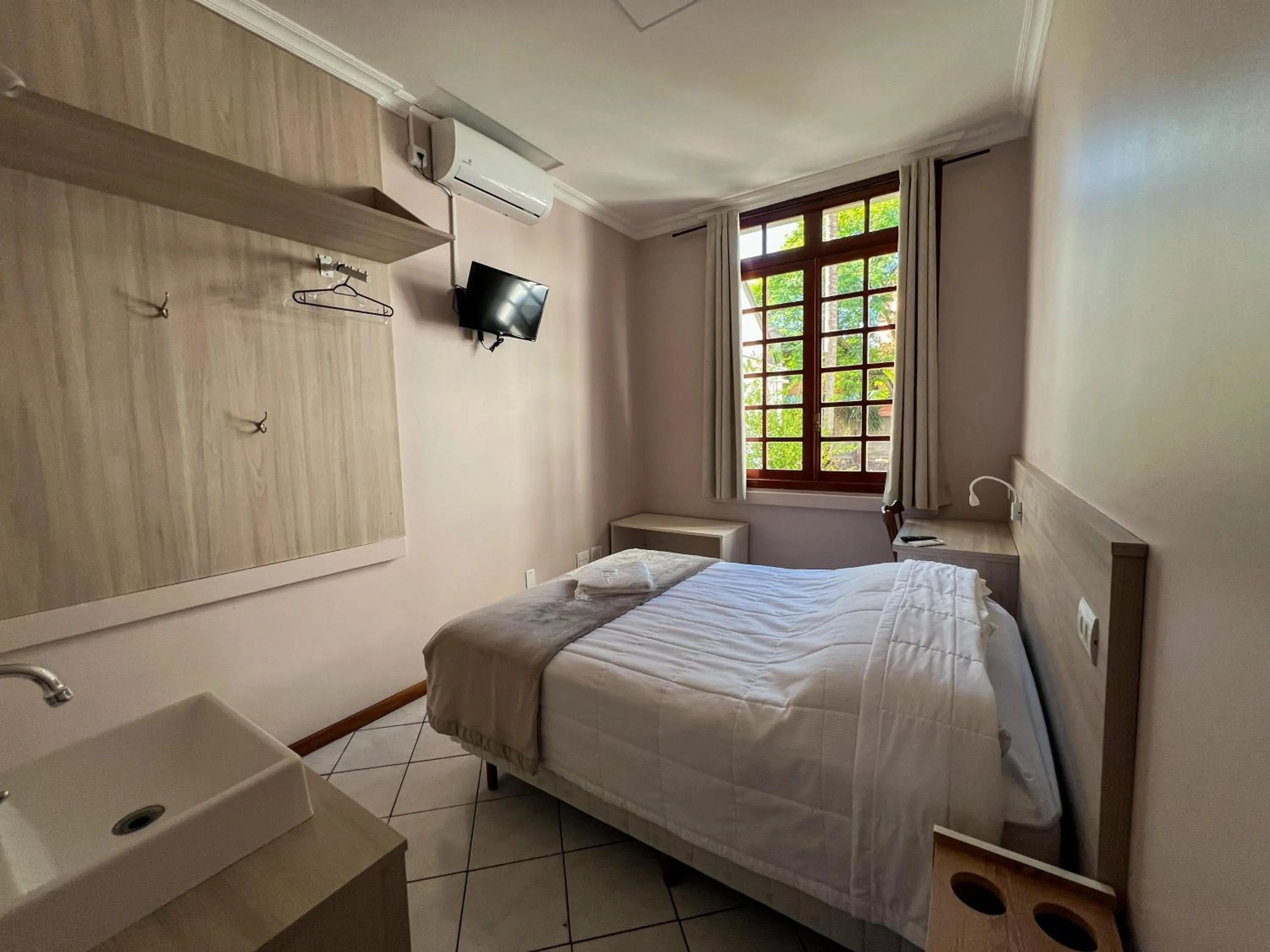 Bed in Hotel Villa Souza Ltda