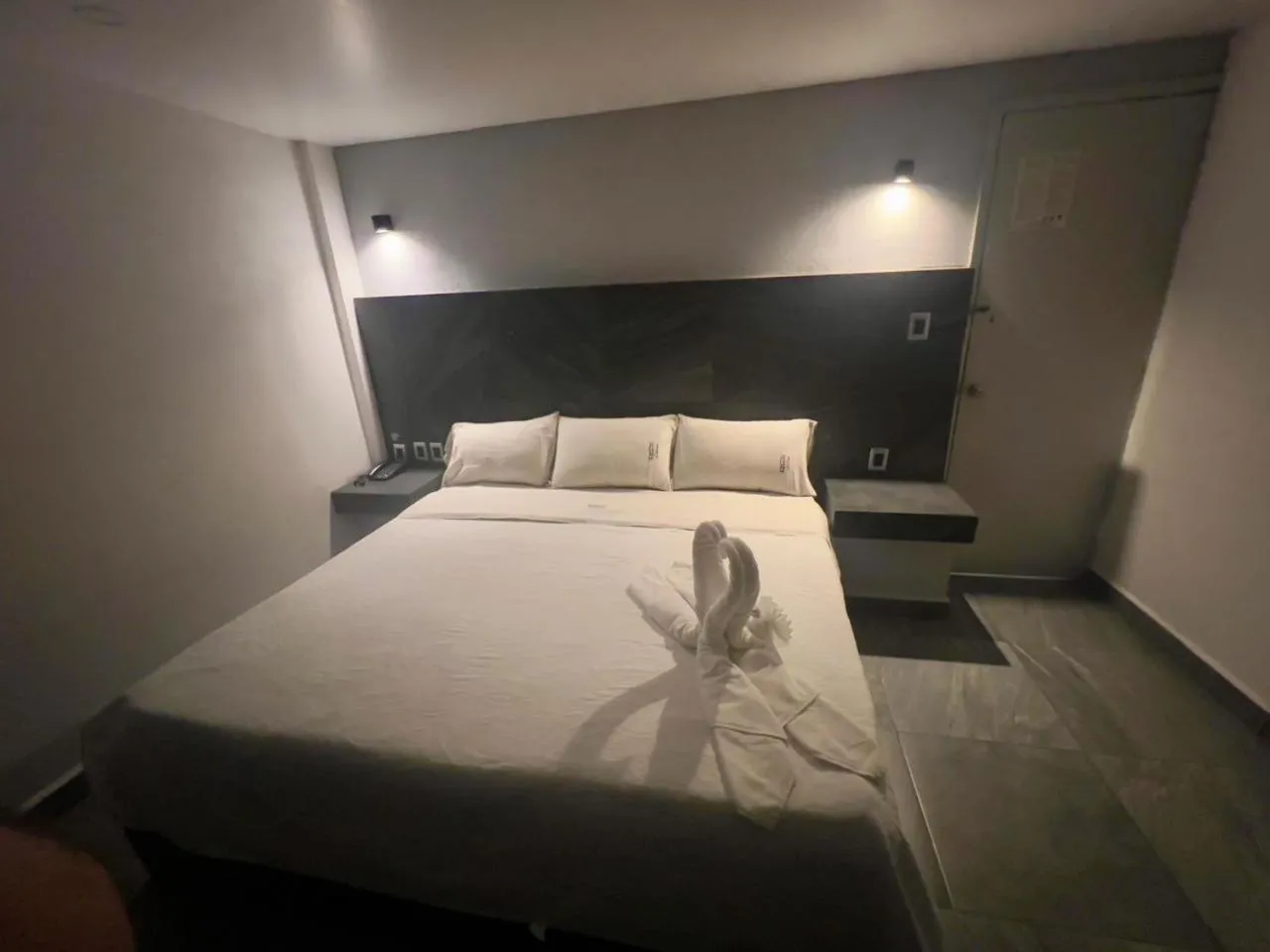 Bed in Hotel Aquario