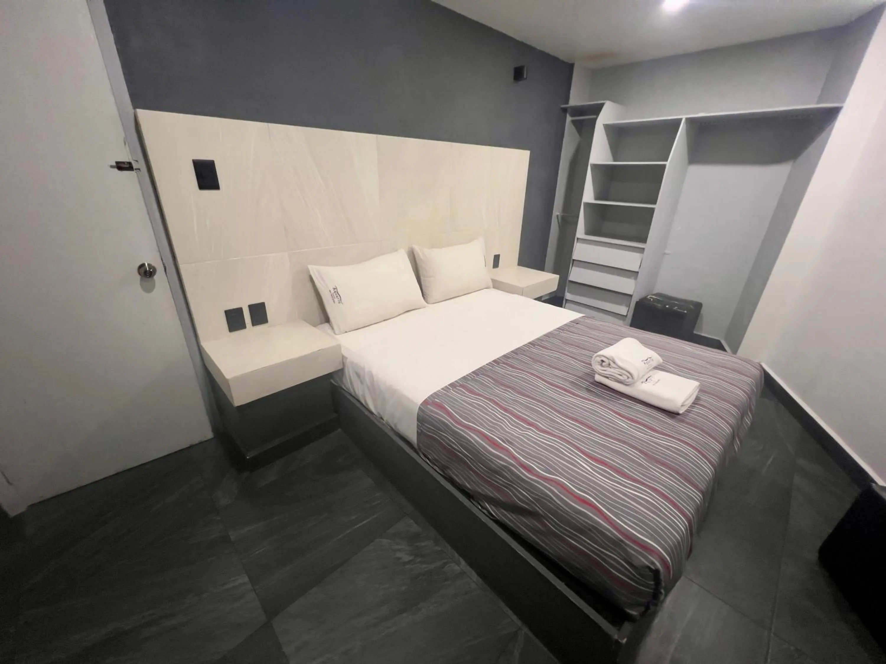 Bed in Hotel Aquario