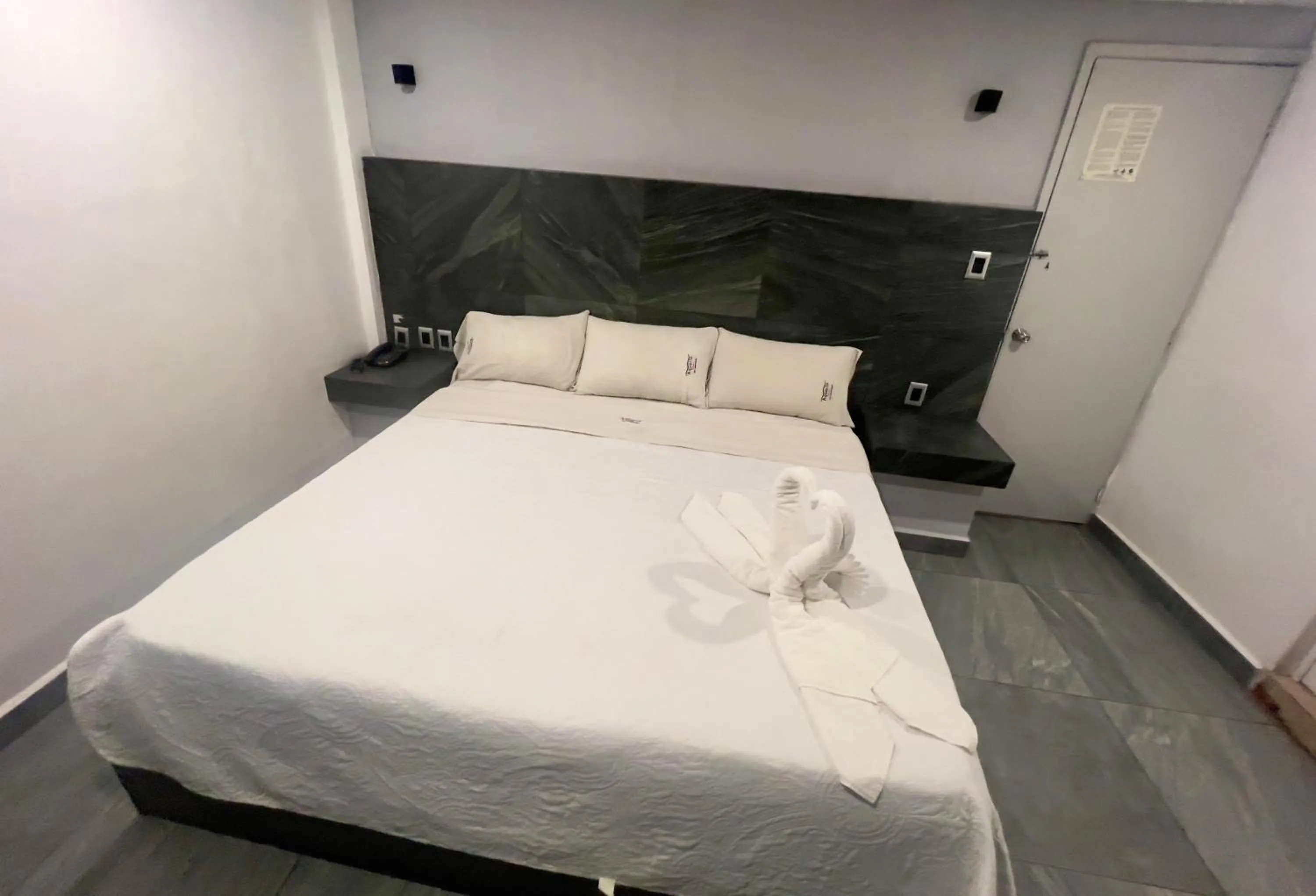 Bed in Hotel Aquario