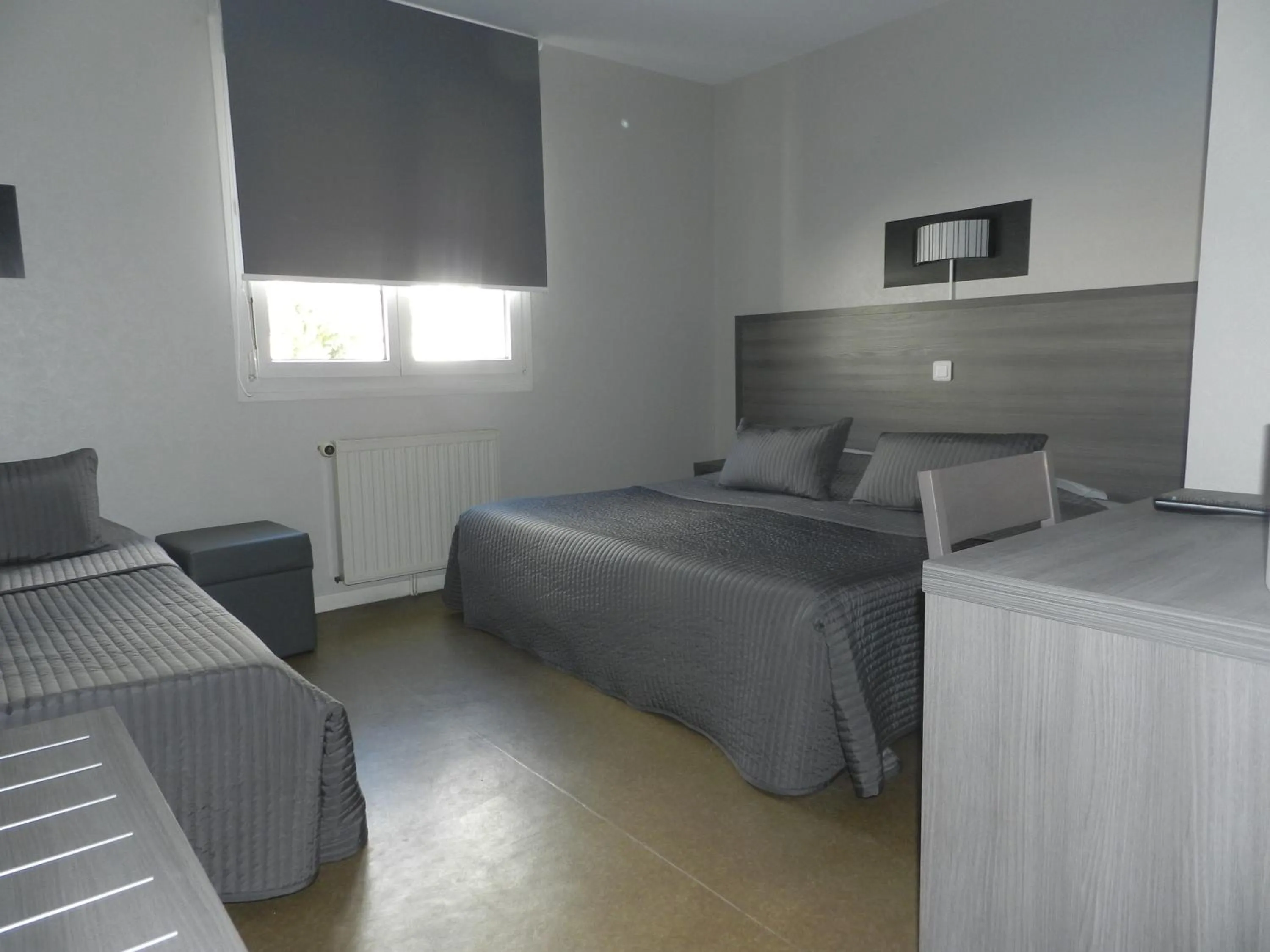 Garden view, Bed in Hôtel Le Cerizay