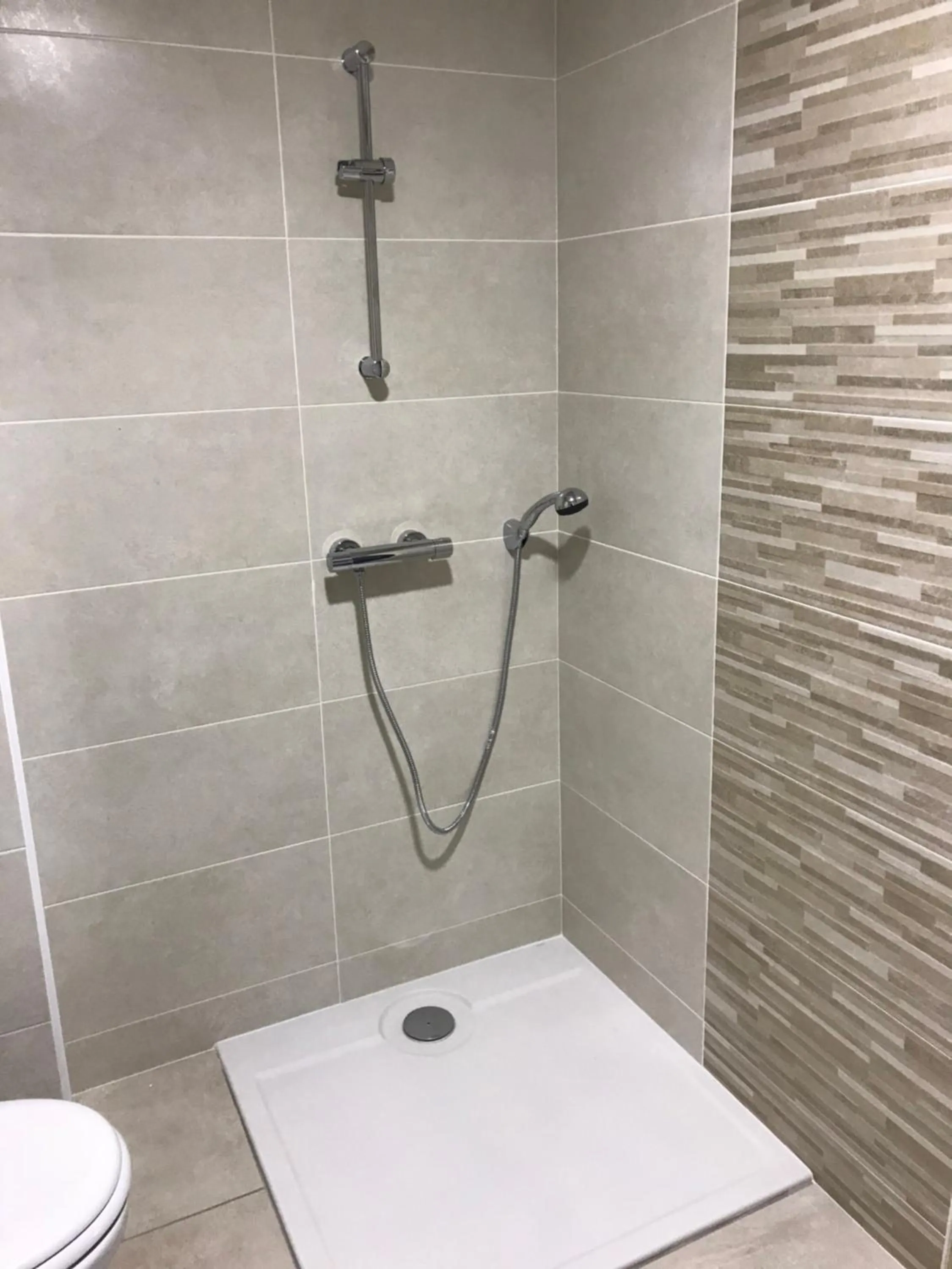 Shower in Hôtel Le Cerizay