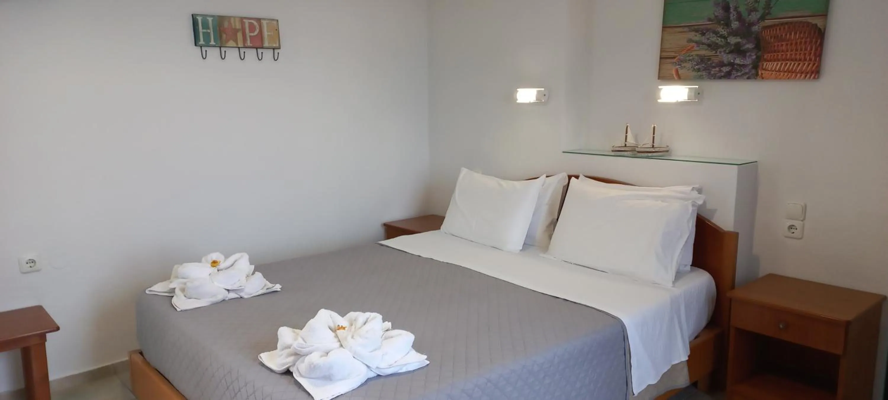 Bed in Aspri Petra Apartments