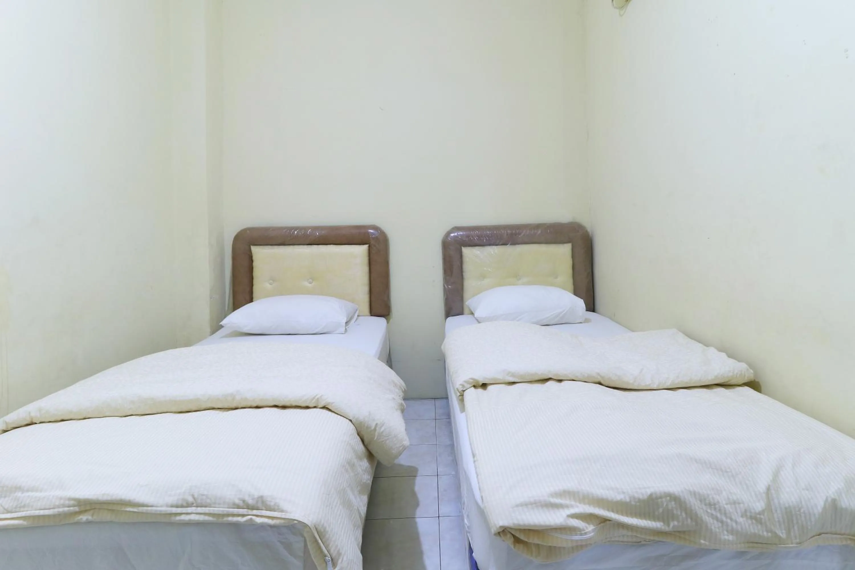 Bed in Guest House Samarinda