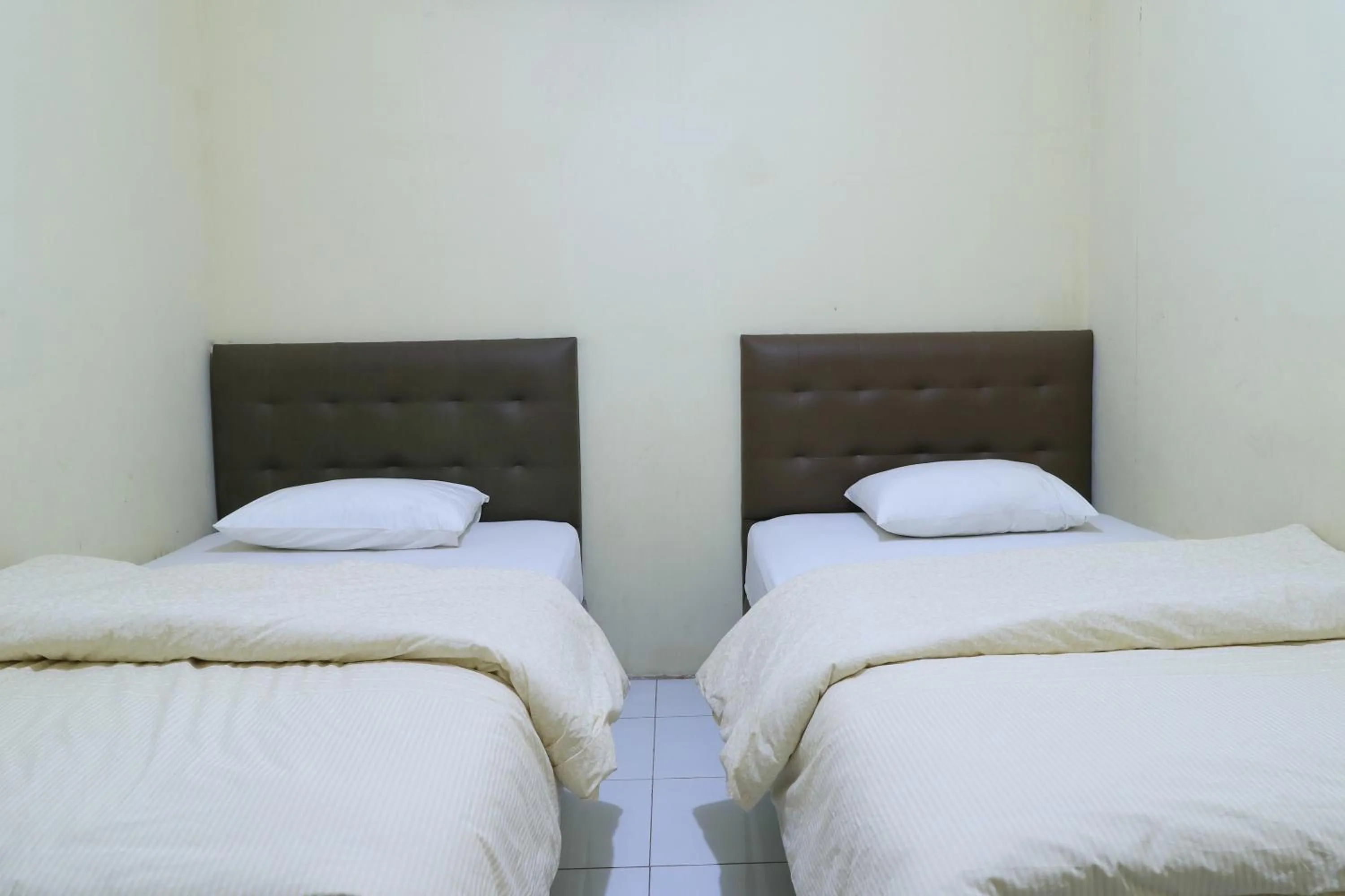 Bed in Guest House Samarinda