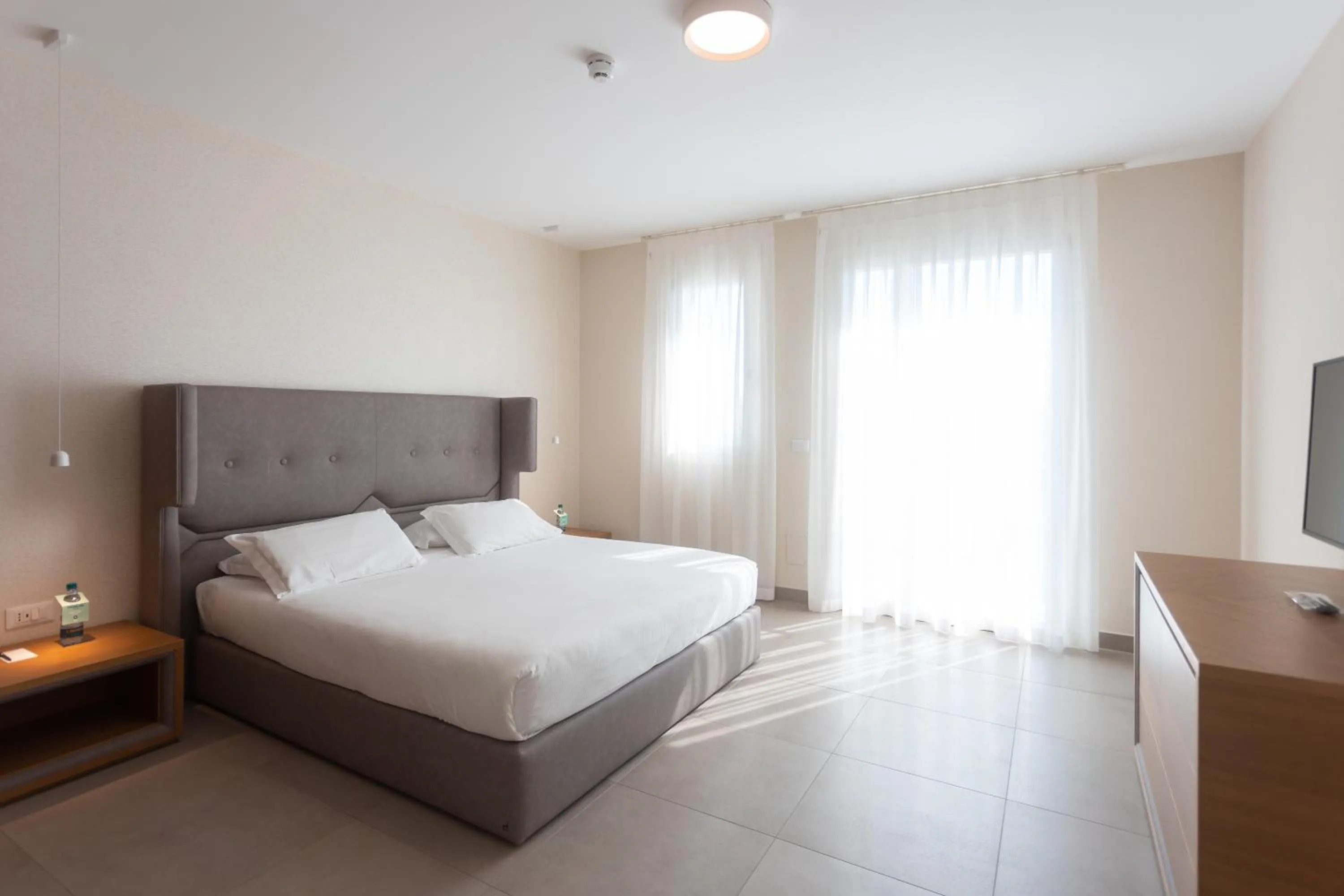 Bed in Mosella Suite Hotel