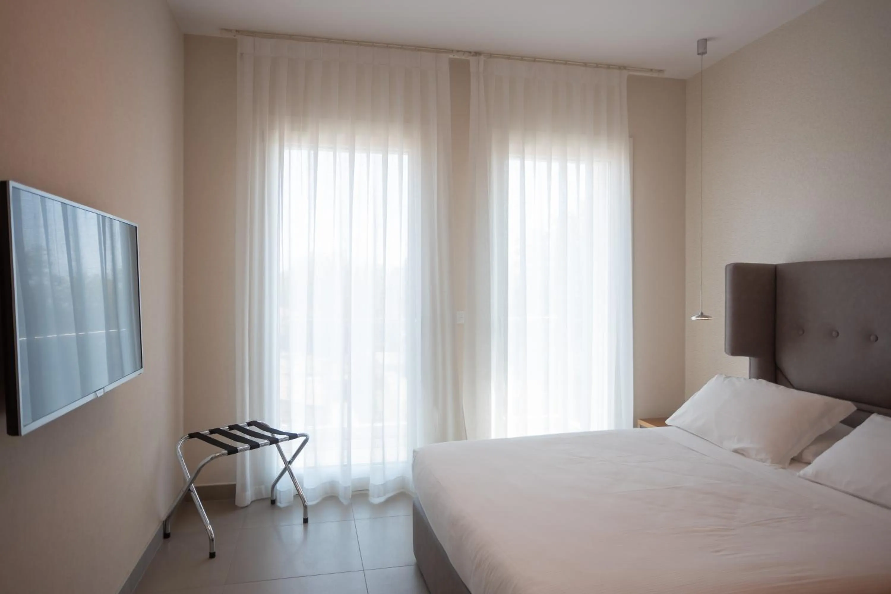 Bed in Mosella Suite Hotel