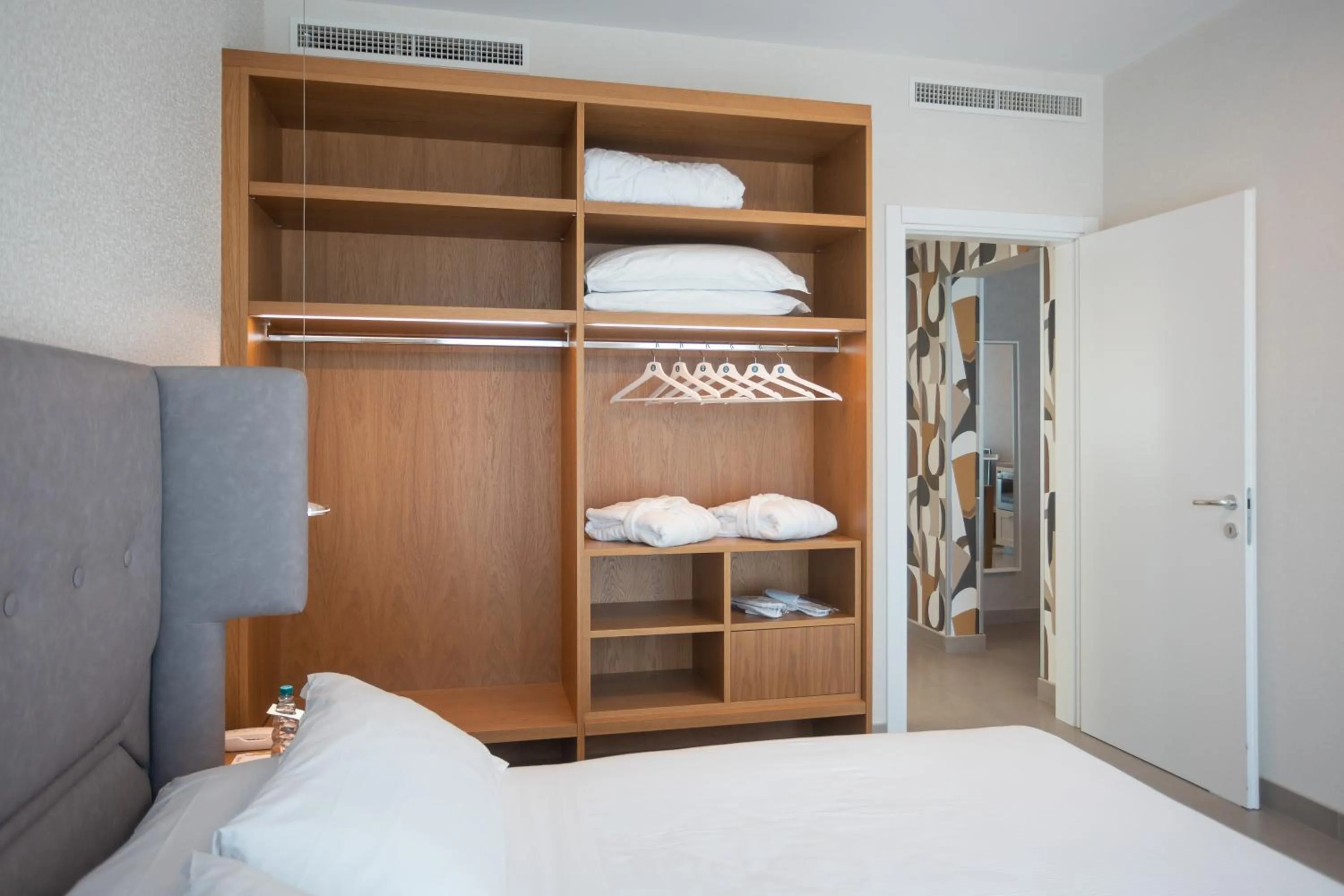 Bed in Mosella Suite Hotel