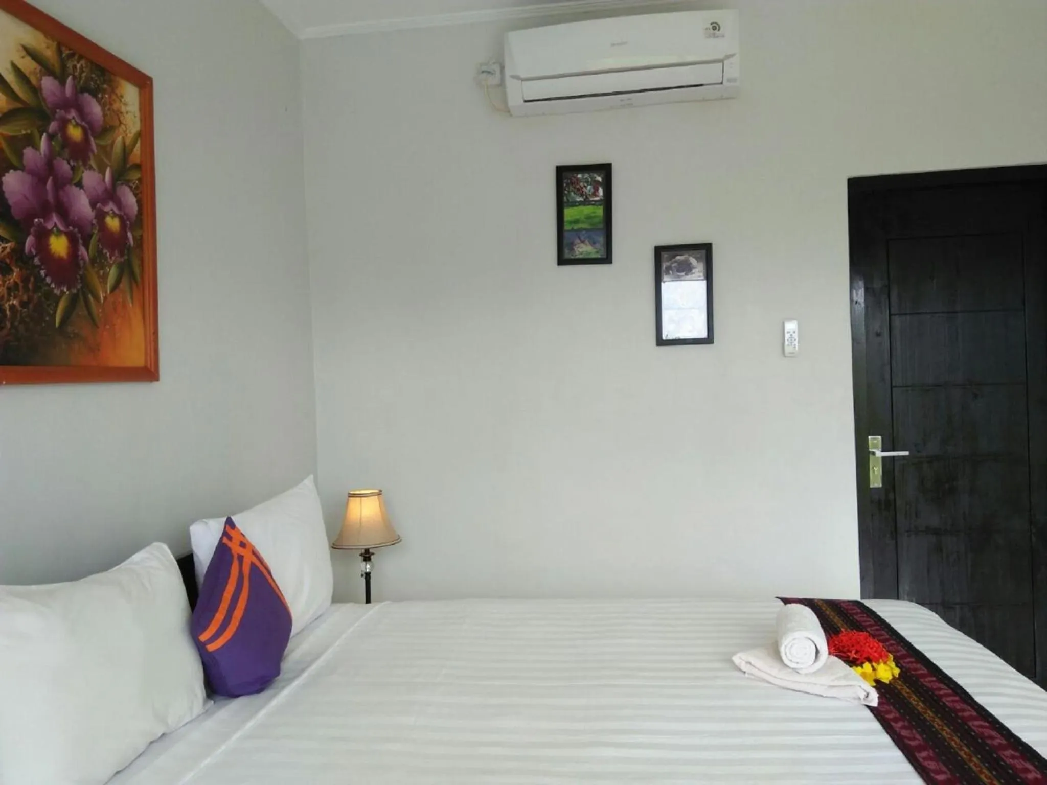 Bed in CF Komodo Hotel