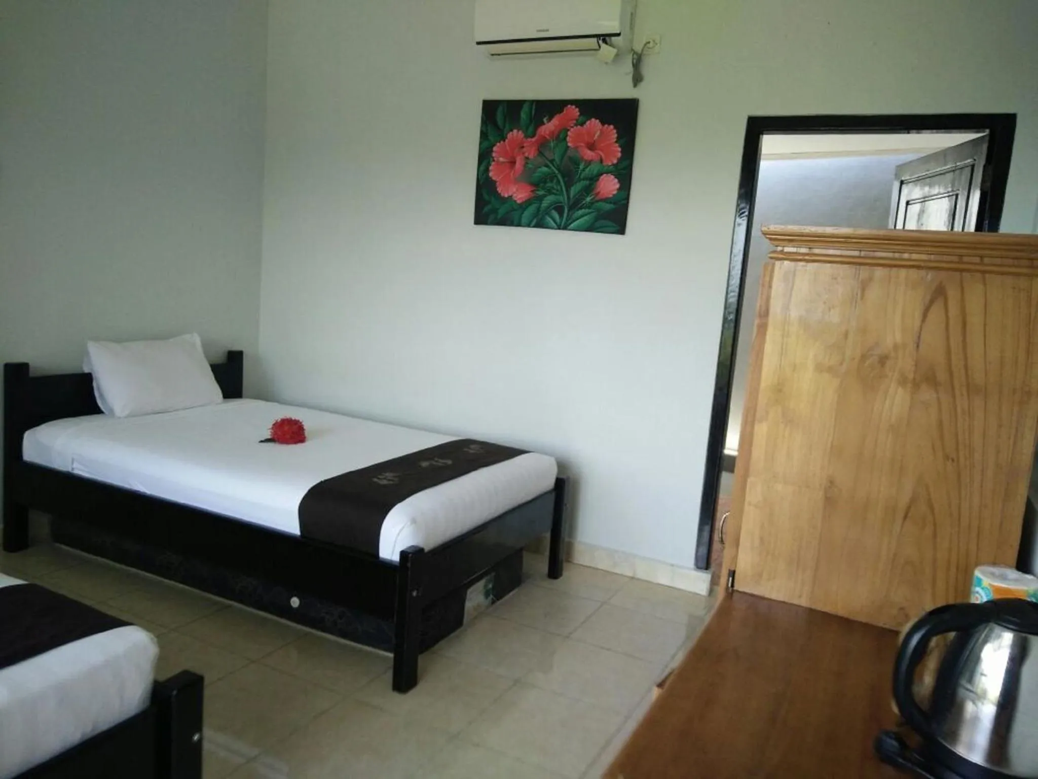 Bed in CF Komodo Hotel