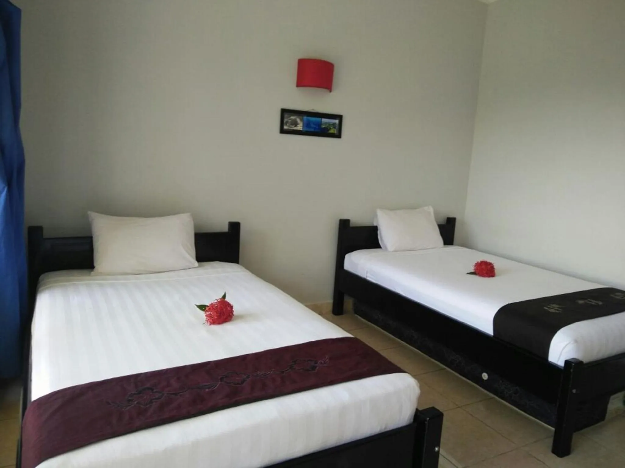 Bed in CF Komodo Hotel