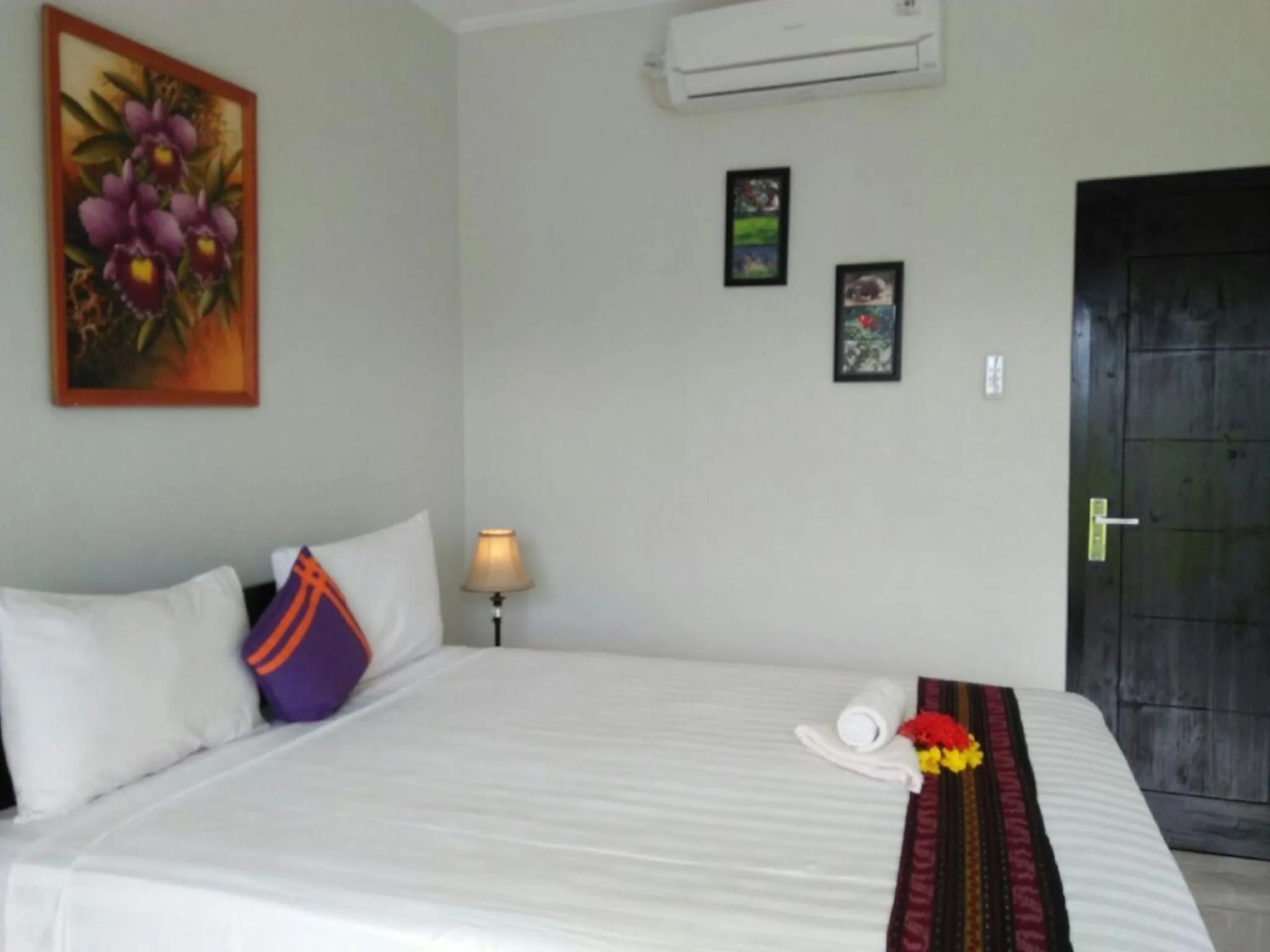 Bed in CF Komodo Hotel