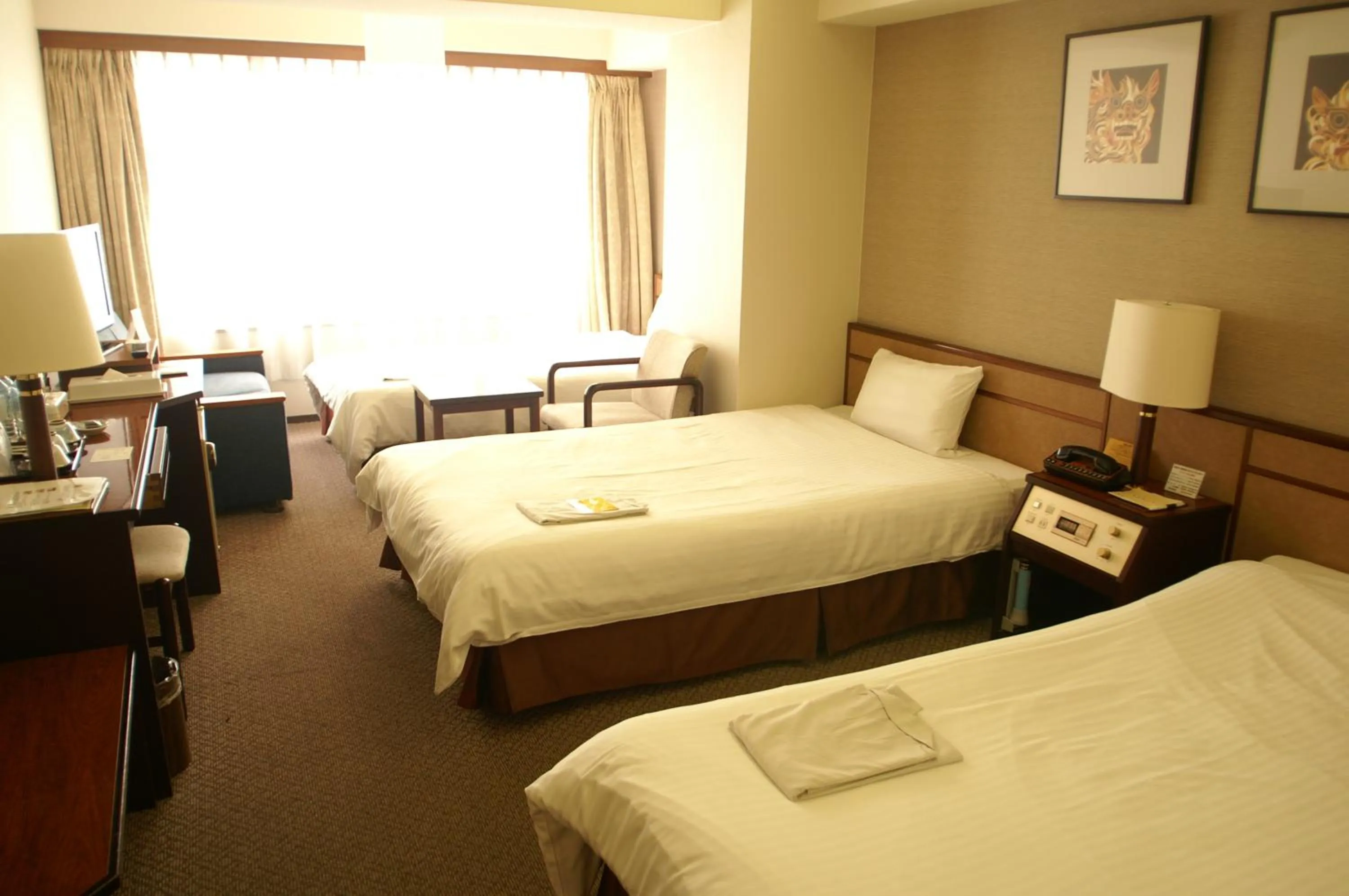 Photo of the whole room, Bed in Ryukyu Sun Royal Hotel