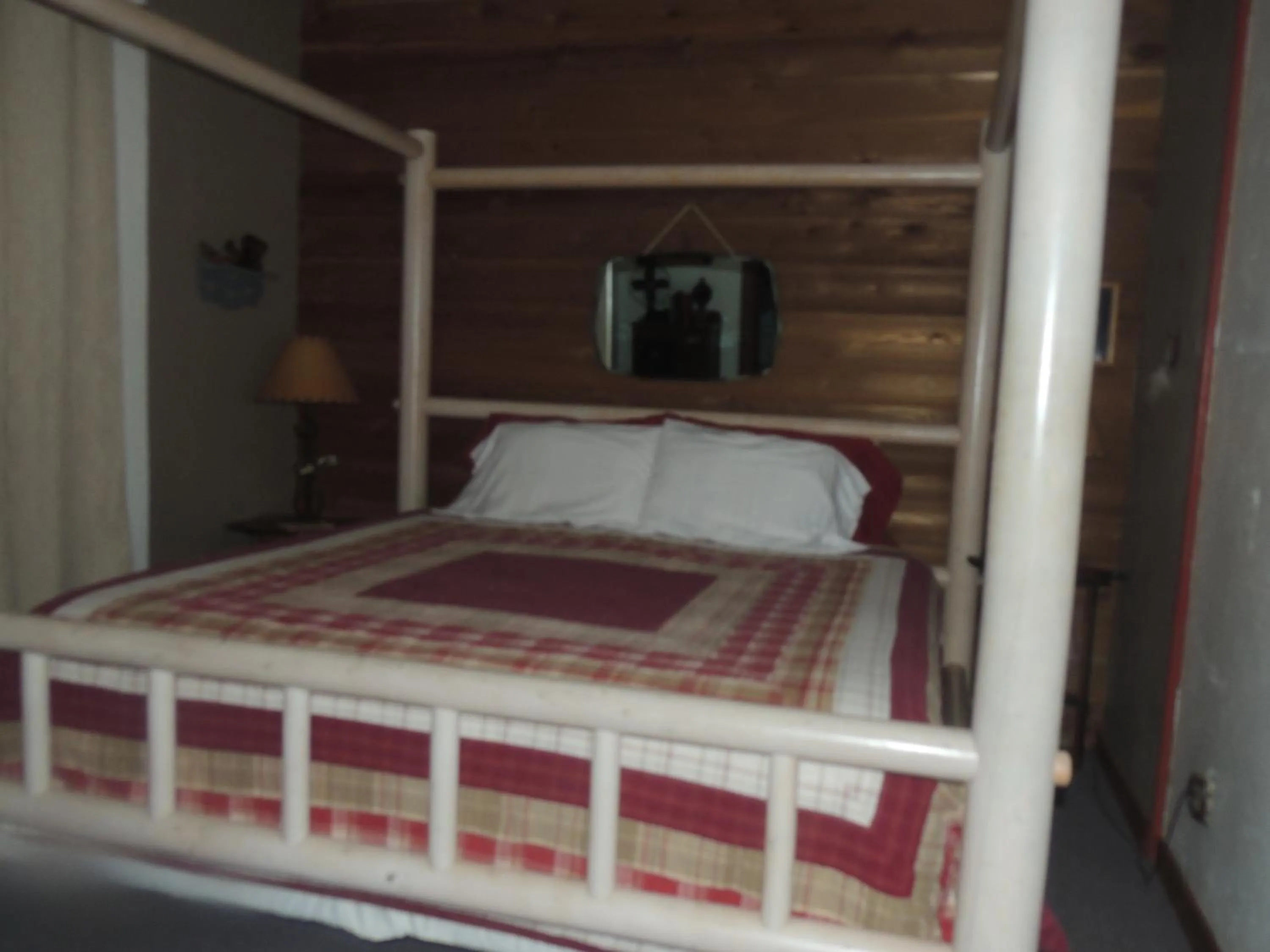 Bed in The Whispering Pines Inn