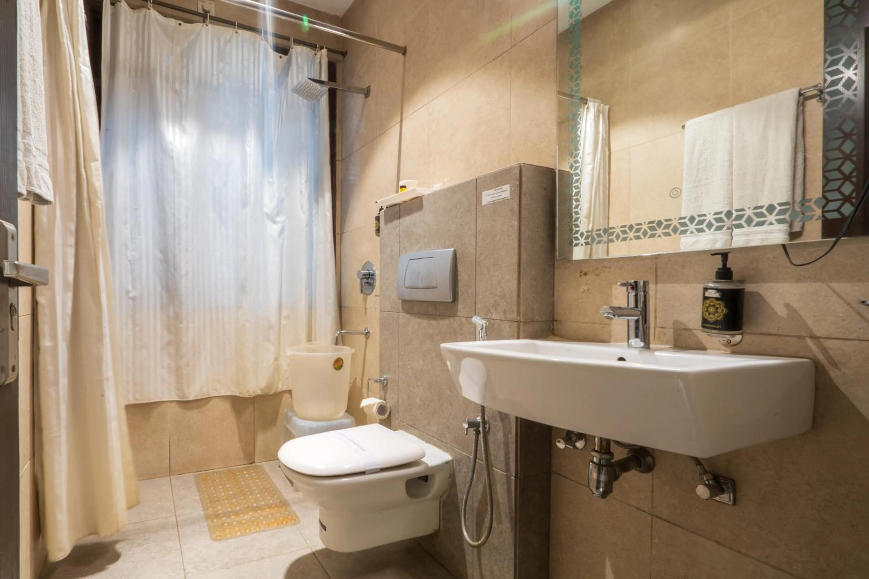 Bathroom in Cosy Grand, Chanakyapuri by The Cosy Hotels