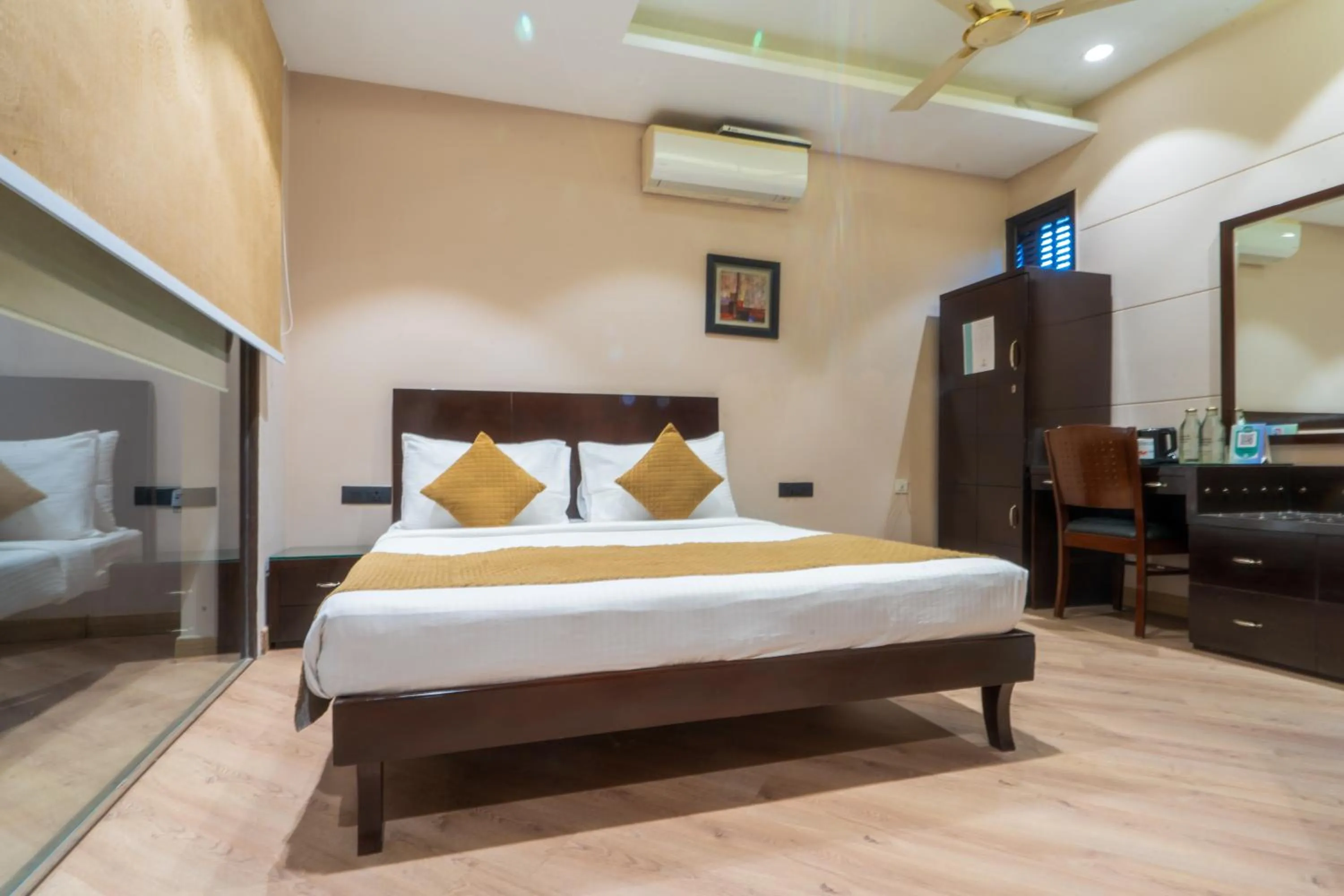 Photo of the whole room, Bed in Cosy Grand, Chanakyapuri by The Cosy Hotels