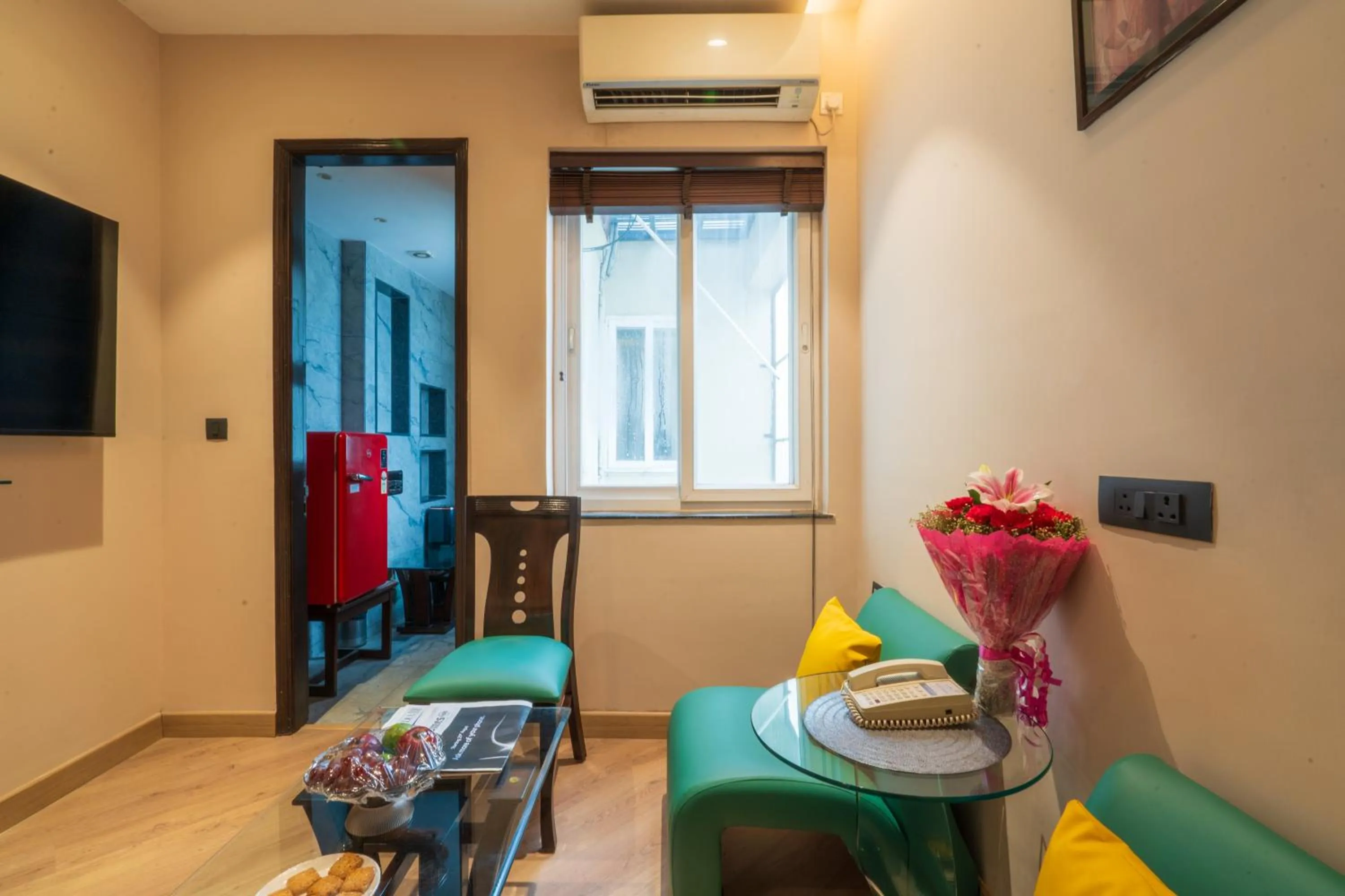 Seating area in Cosy Grand, Chanakyapuri by The Cosy Hotels