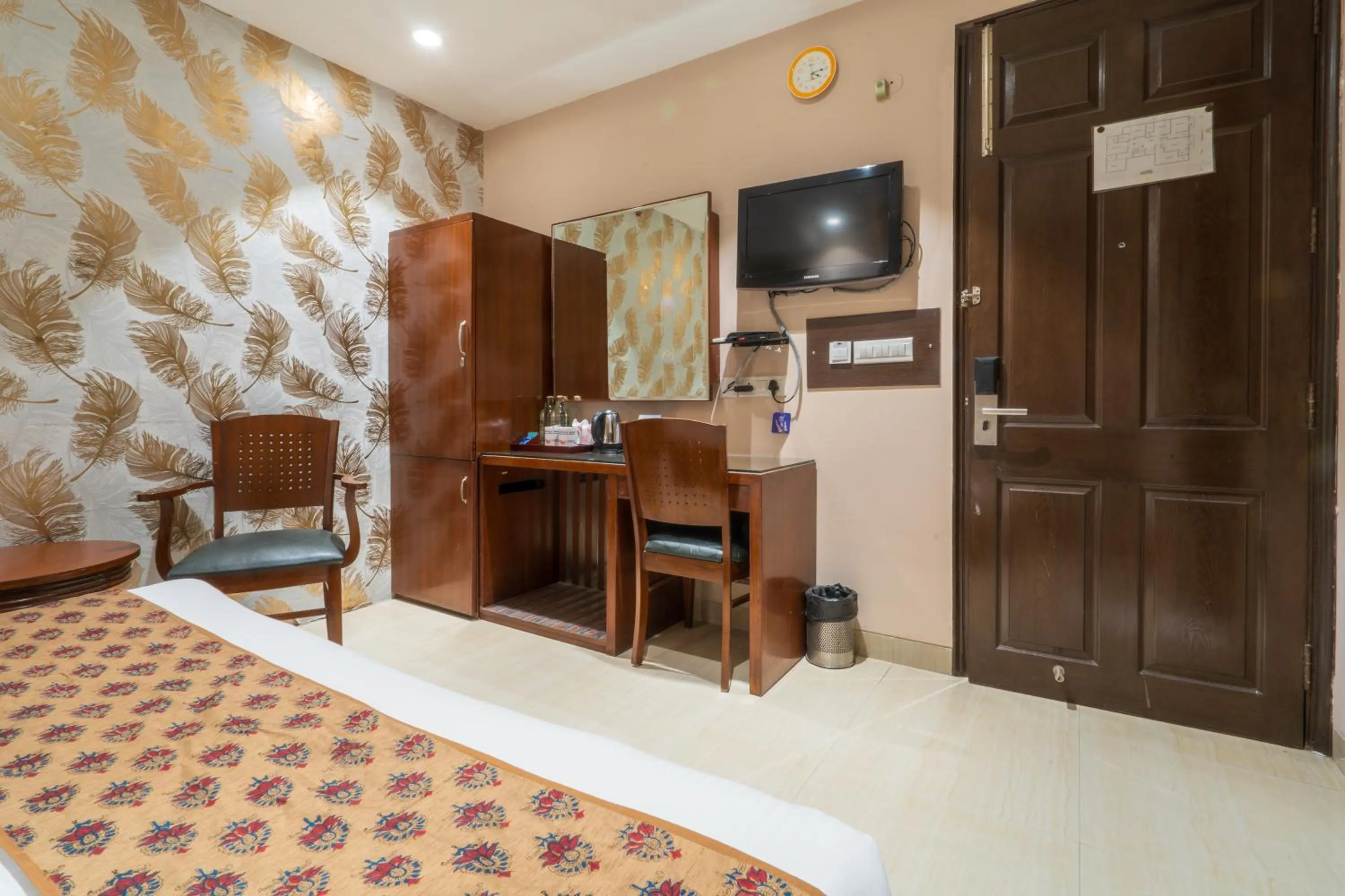 Bedroom in Cosy Grand, Chanakyapuri by The Cosy Hotels