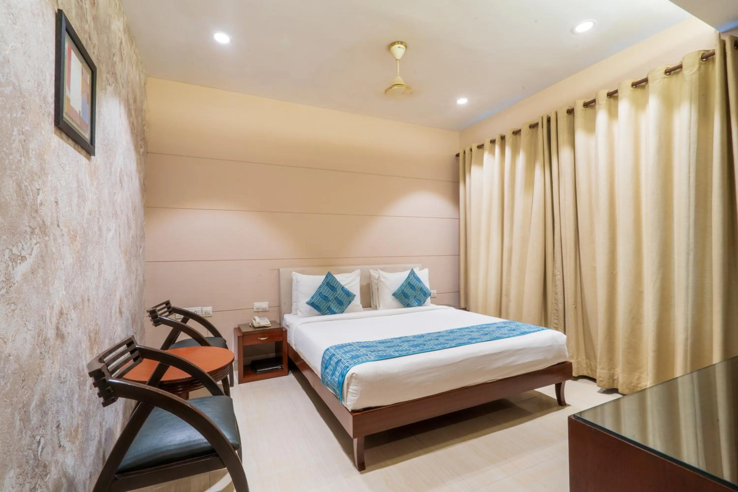 Photo of the whole room, Bed in Cosy Grand, Chanakyapuri by The Cosy Hotels