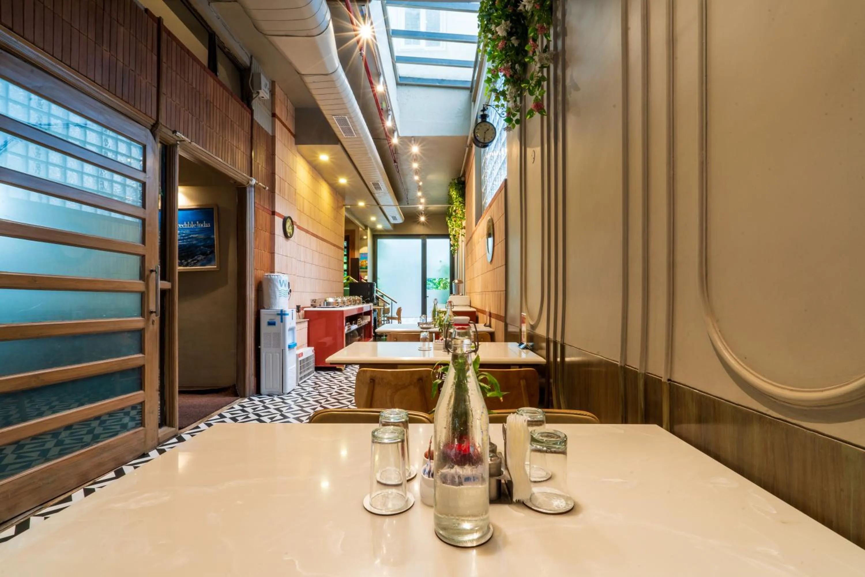 Dining area in Cosy Grand, Chanakyapuri by The Cosy Hotels