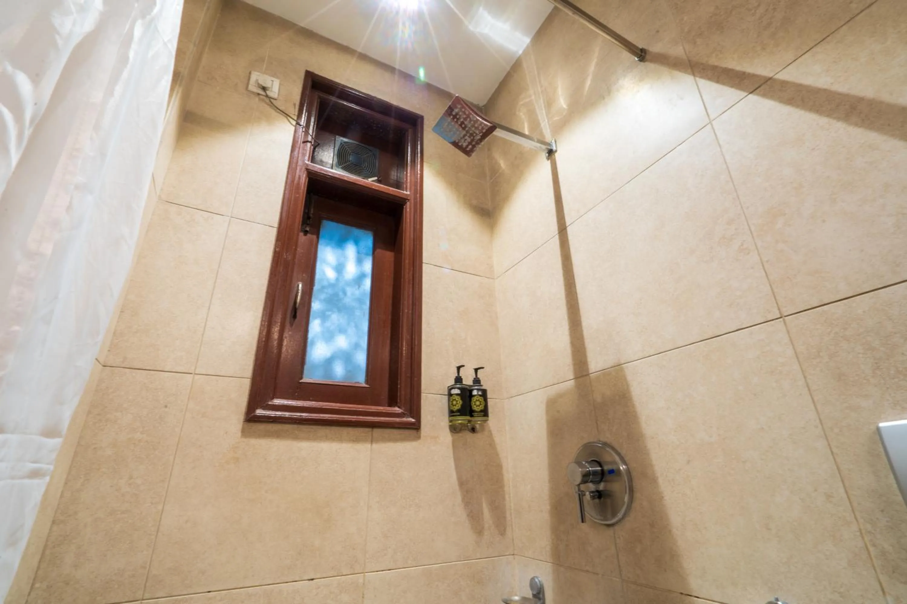 Bathroom in Cosy Grand, Chanakyapuri by The Cosy Hotels