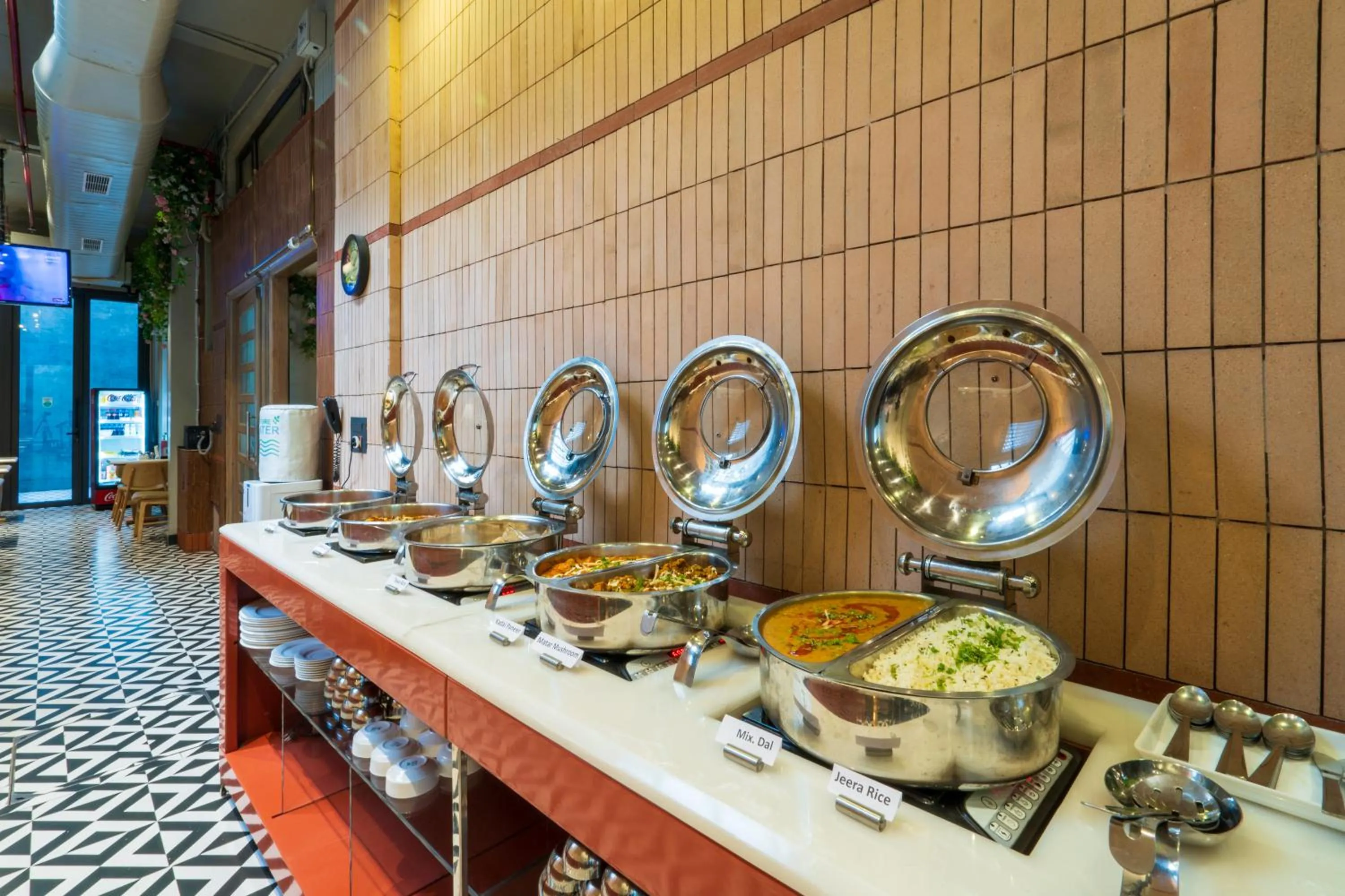 Food in Cosy Grand, Chanakyapuri by The Cosy Hotels