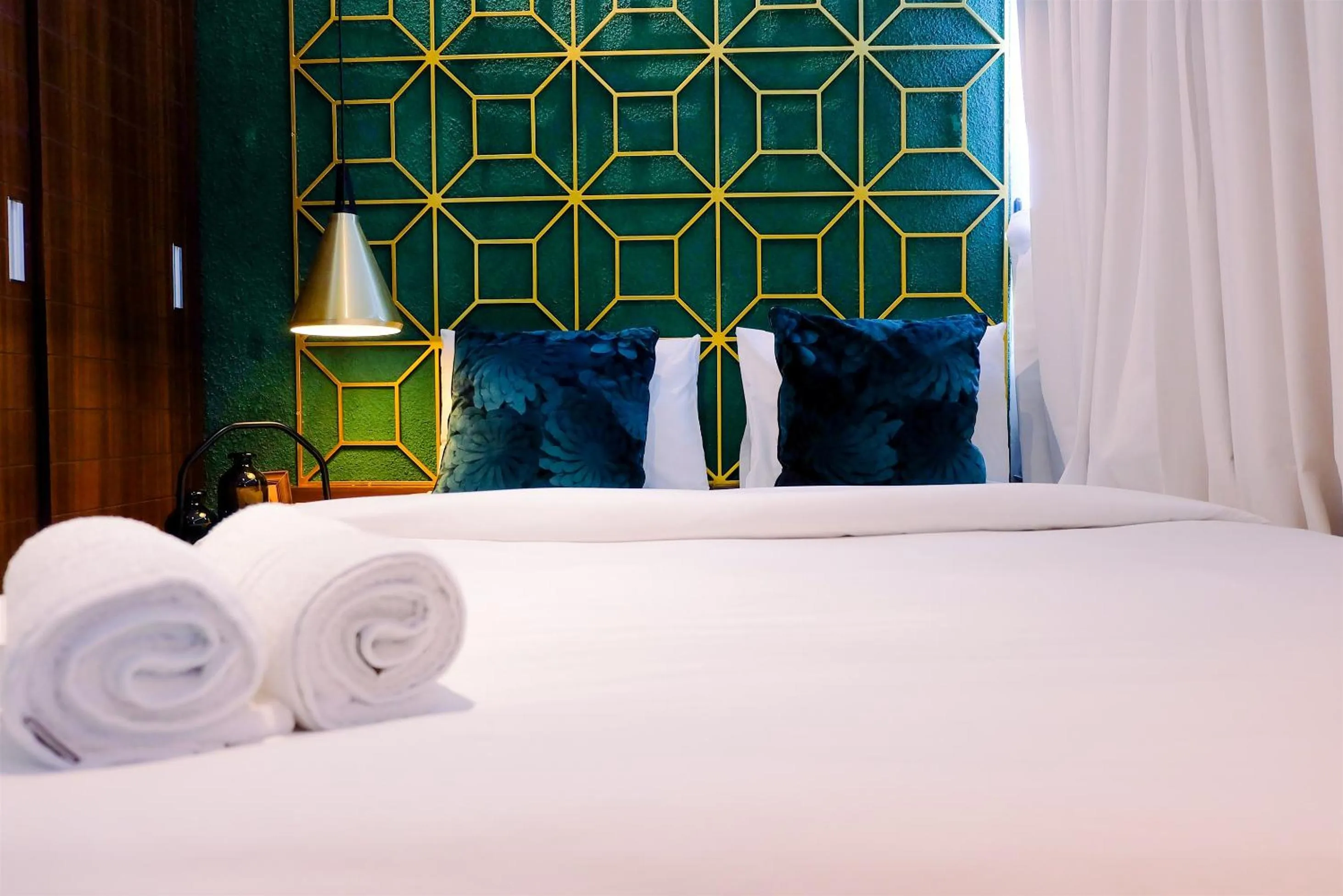 Bed in Modern and Stylish 2BR Pakubuwono Terrace Apartment By Travelio