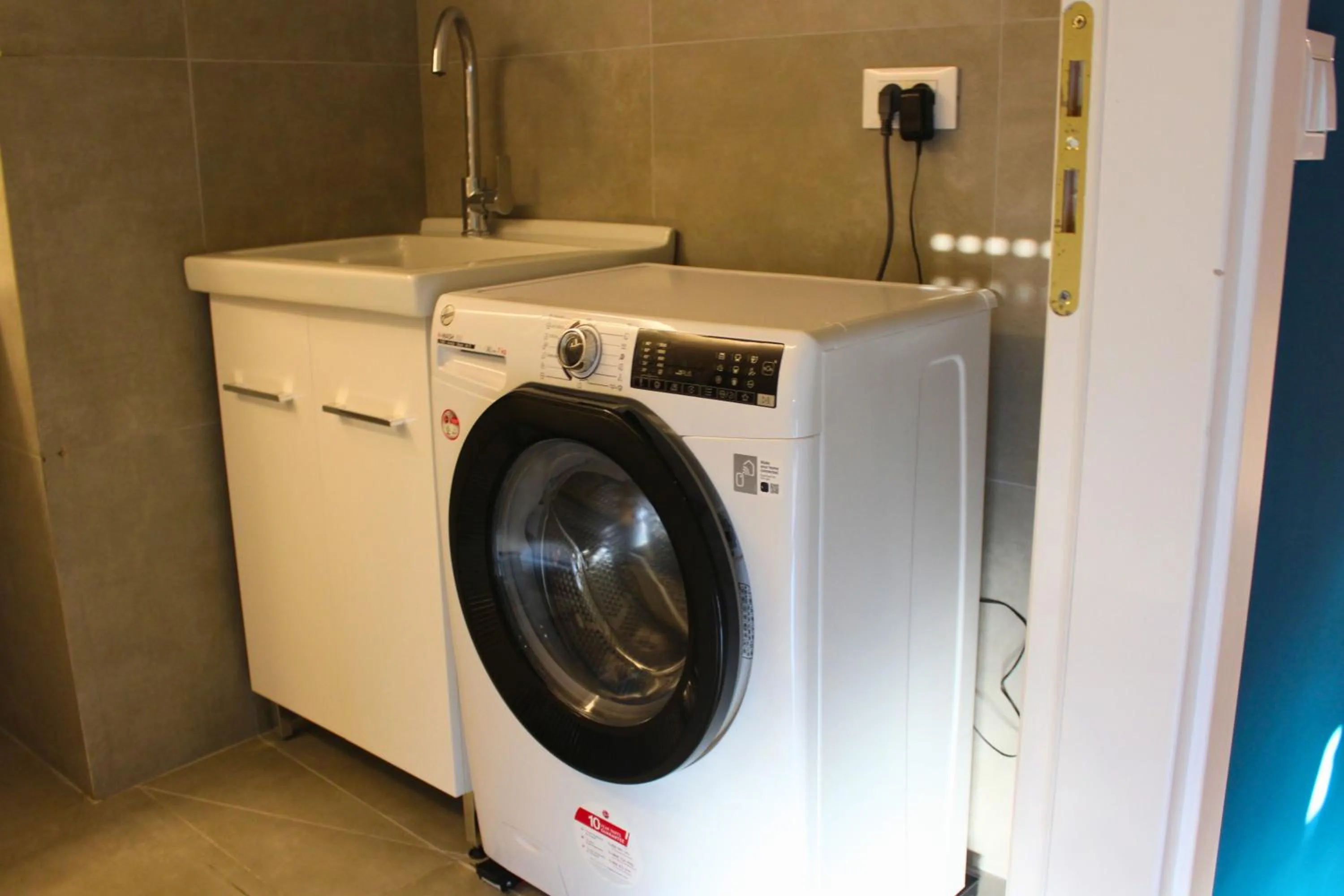 laundry in Oblò Apartment