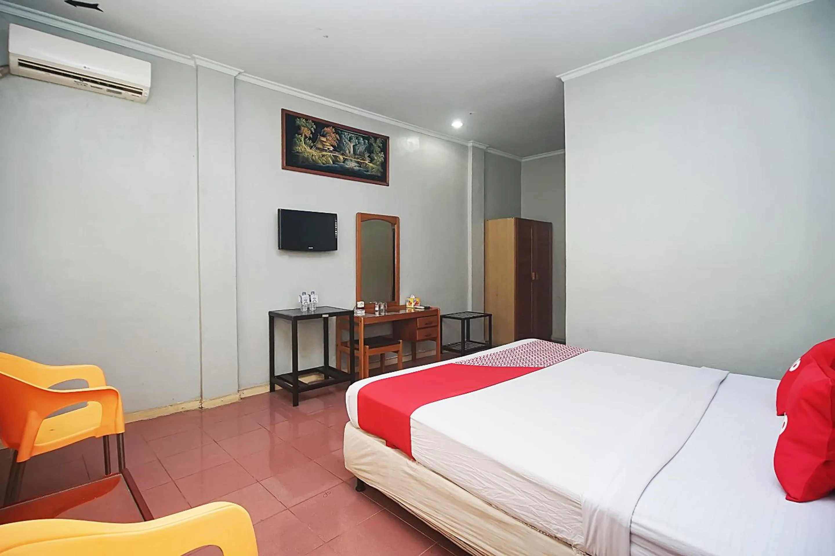 Bedroom in OYO 2079 Jambi Raya Hotel