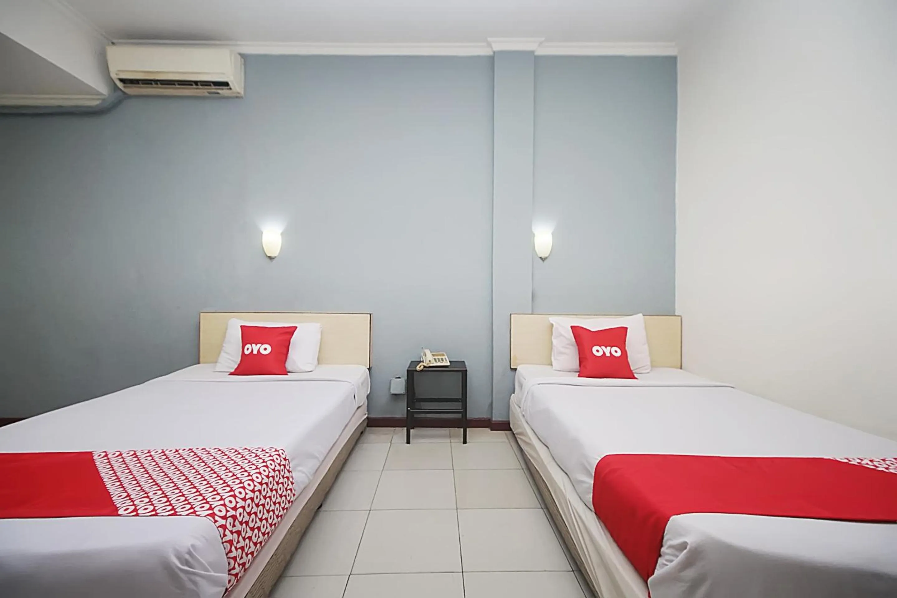 Bedroom in OYO 2079 Jambi Raya Hotel