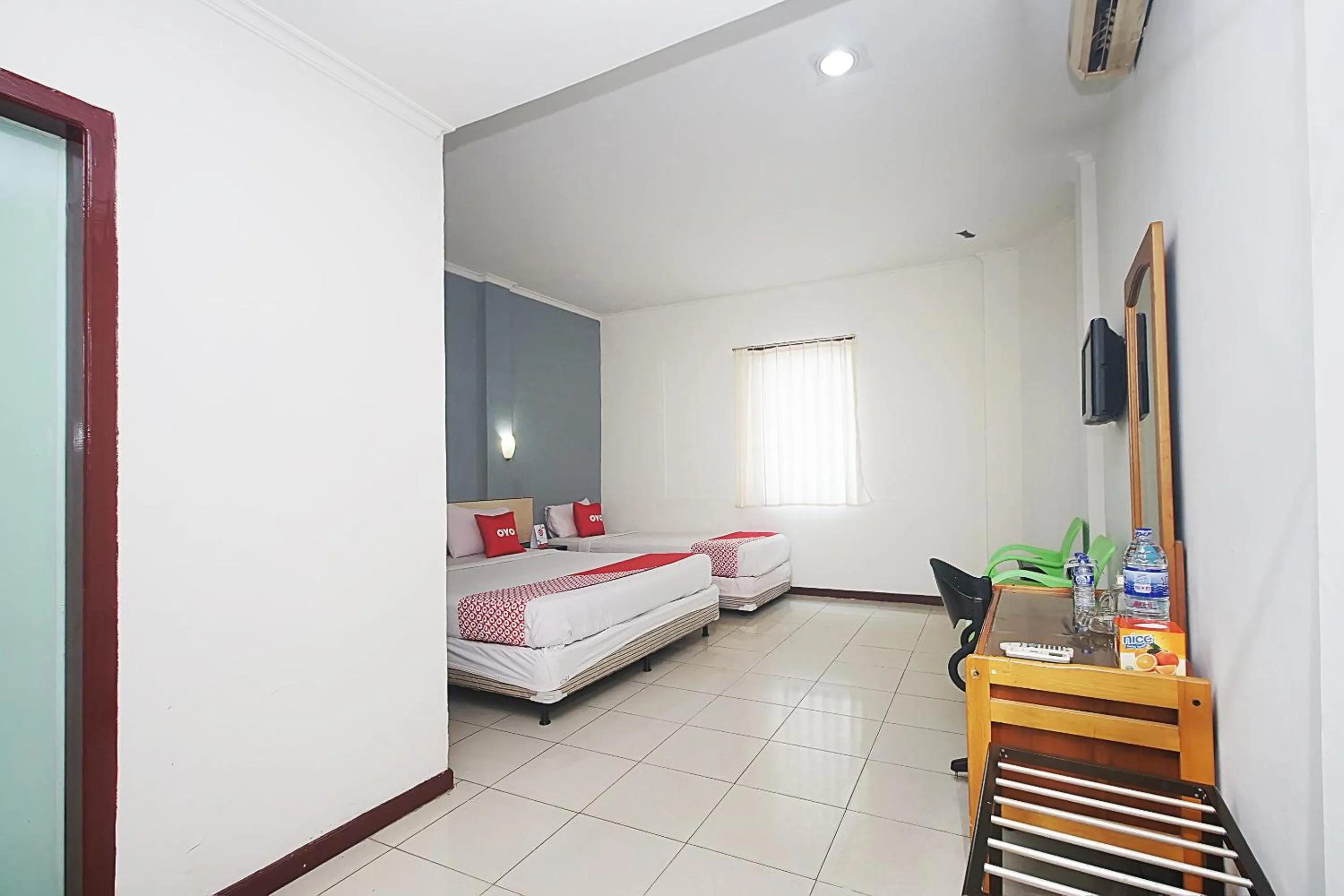 Bedroom in OYO 2079 Jambi Raya Hotel