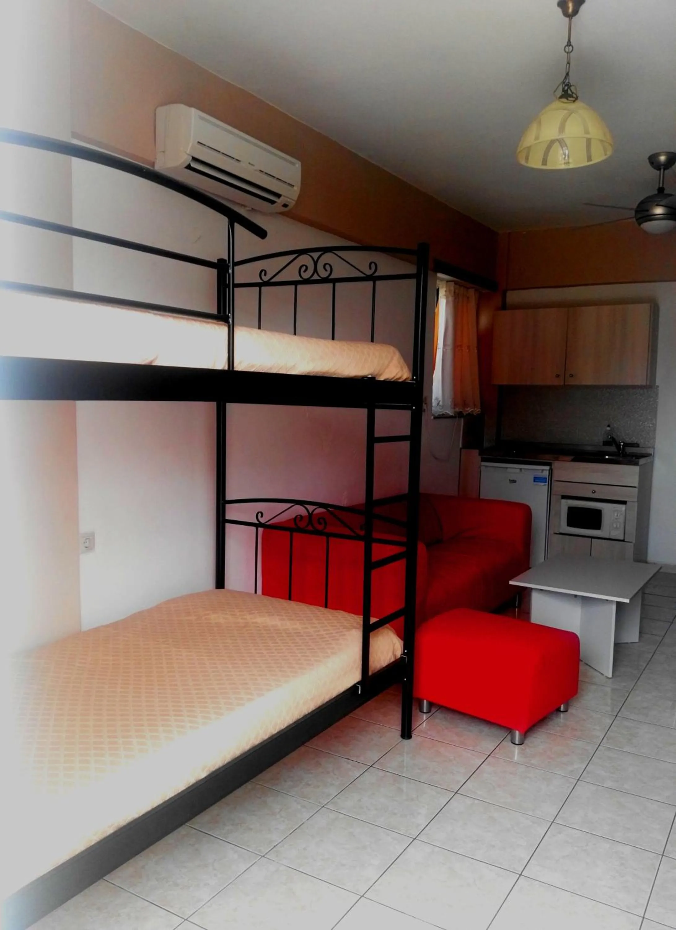 Kitchen or kitchenette, Bed in Baladinos Apartments