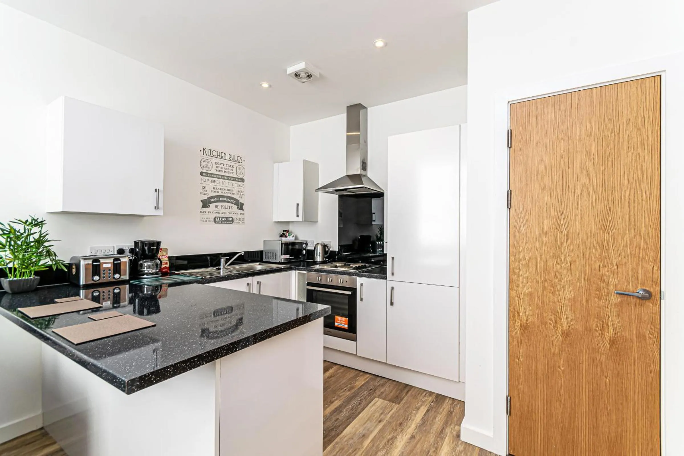 Kitchen or kitchenette in City Suites by Guestz