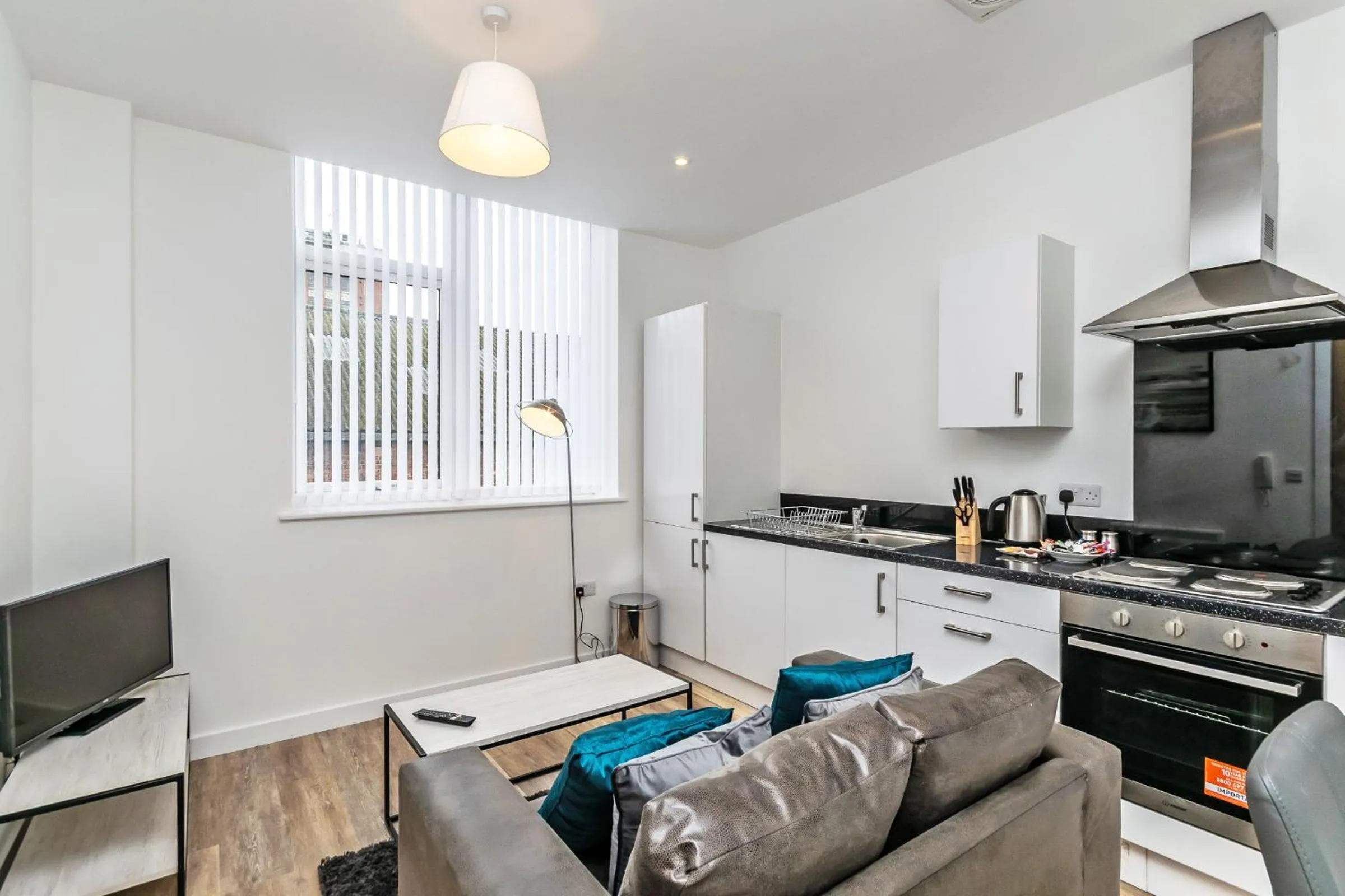 Kitchen or kitchenette in City Suites by Guestz