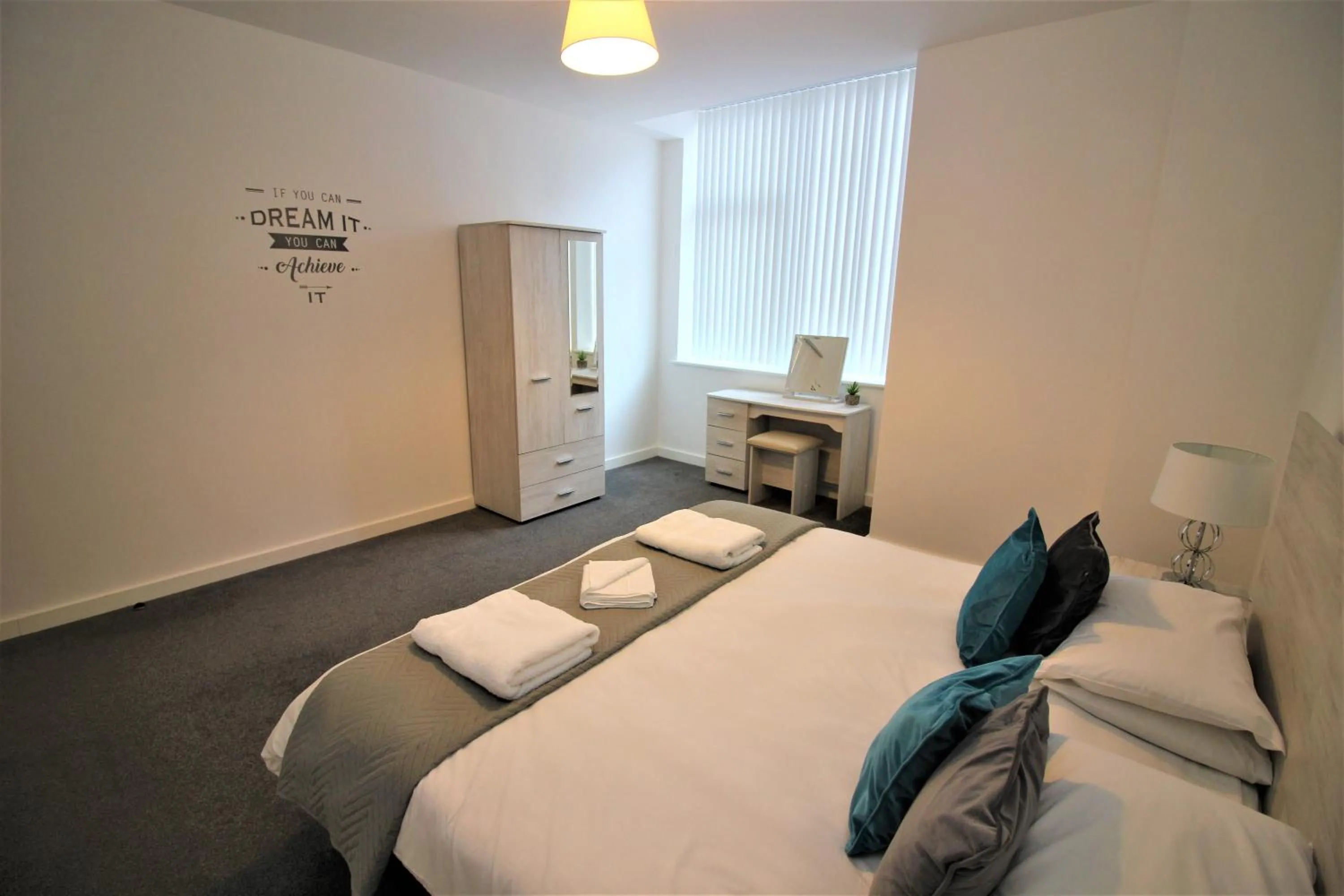 Photo of the whole room, Bed in City Suites by Guestz