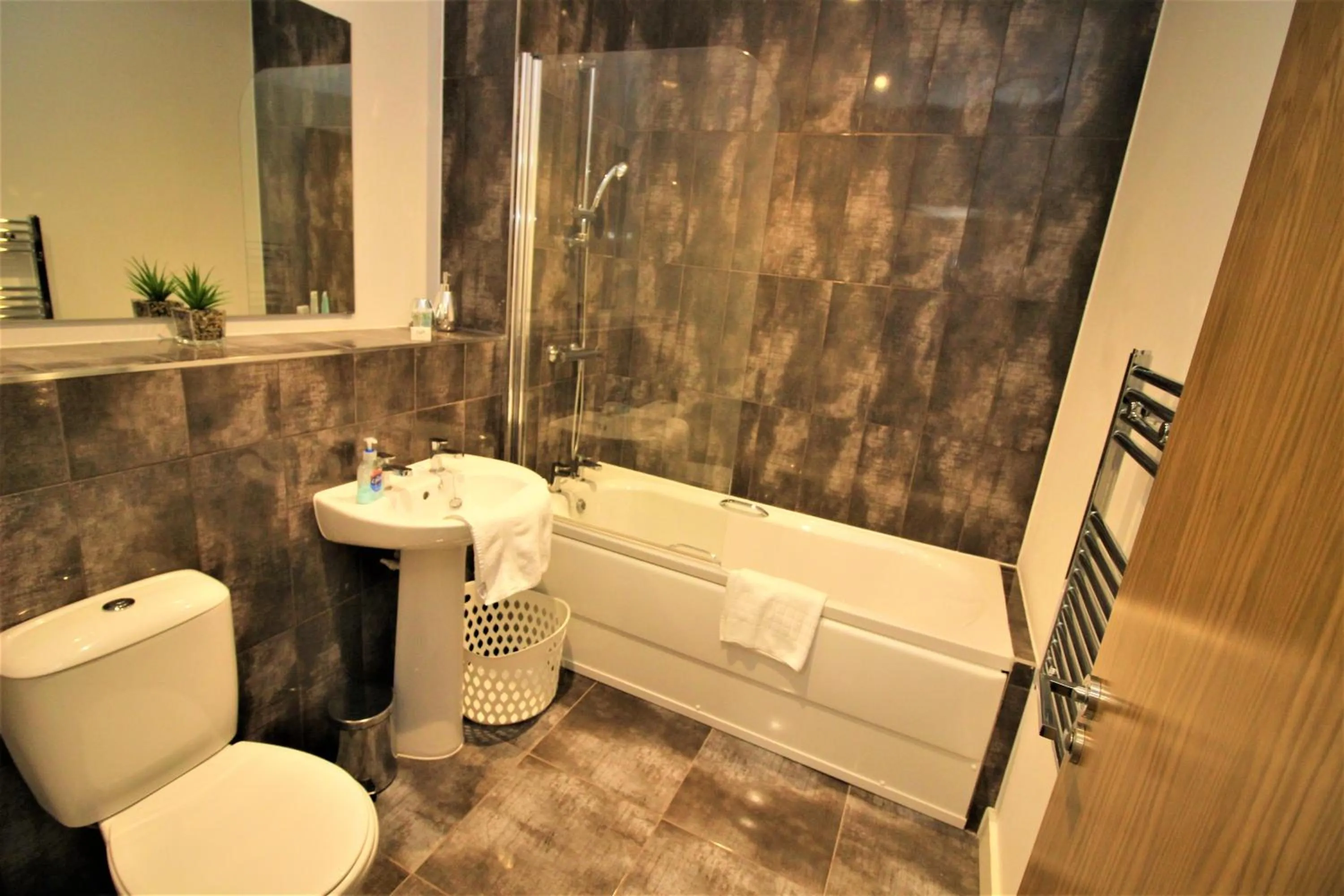 Bathroom in City Suites by Guestz