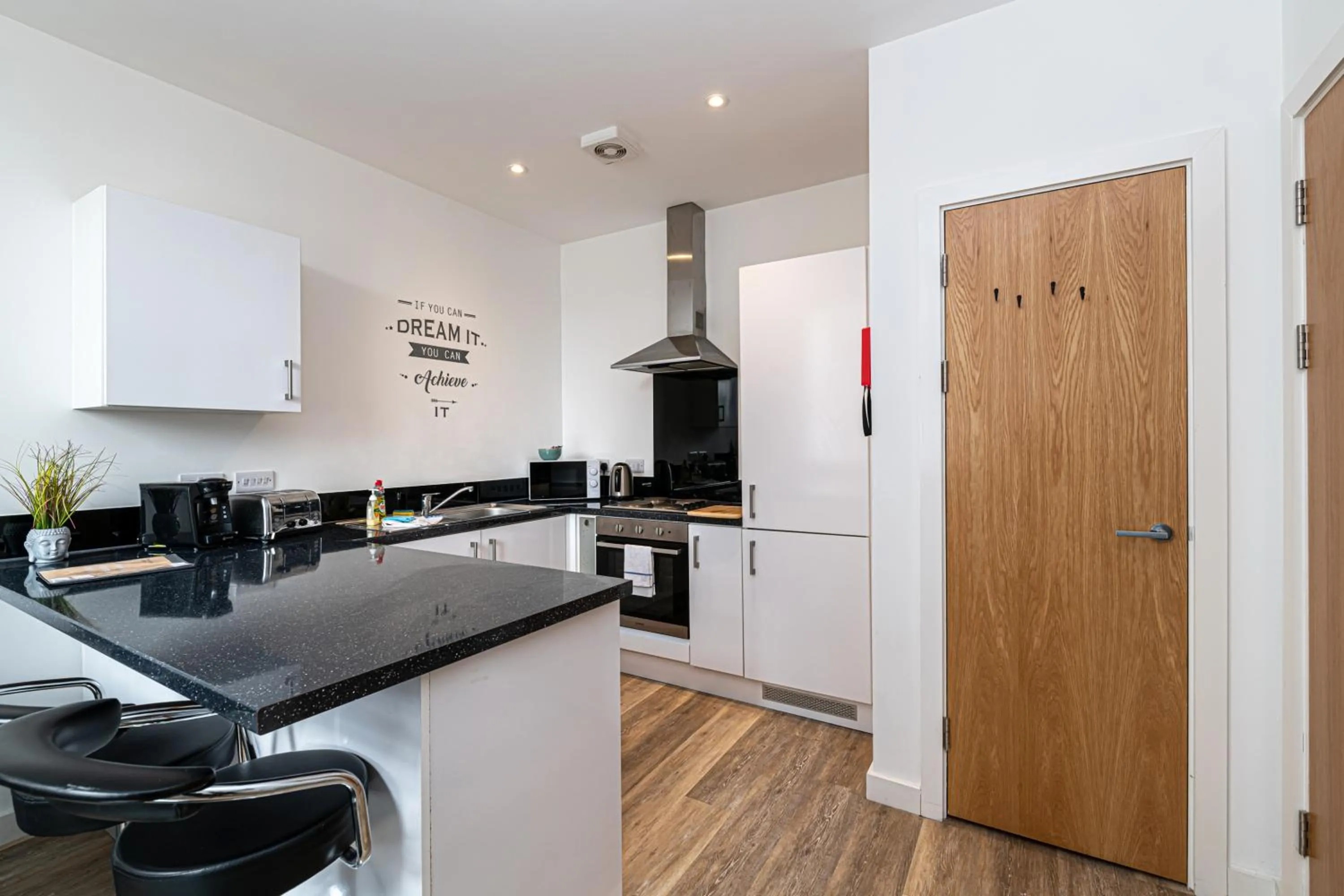 Kitchen or kitchenette in City Suites by Guestz
