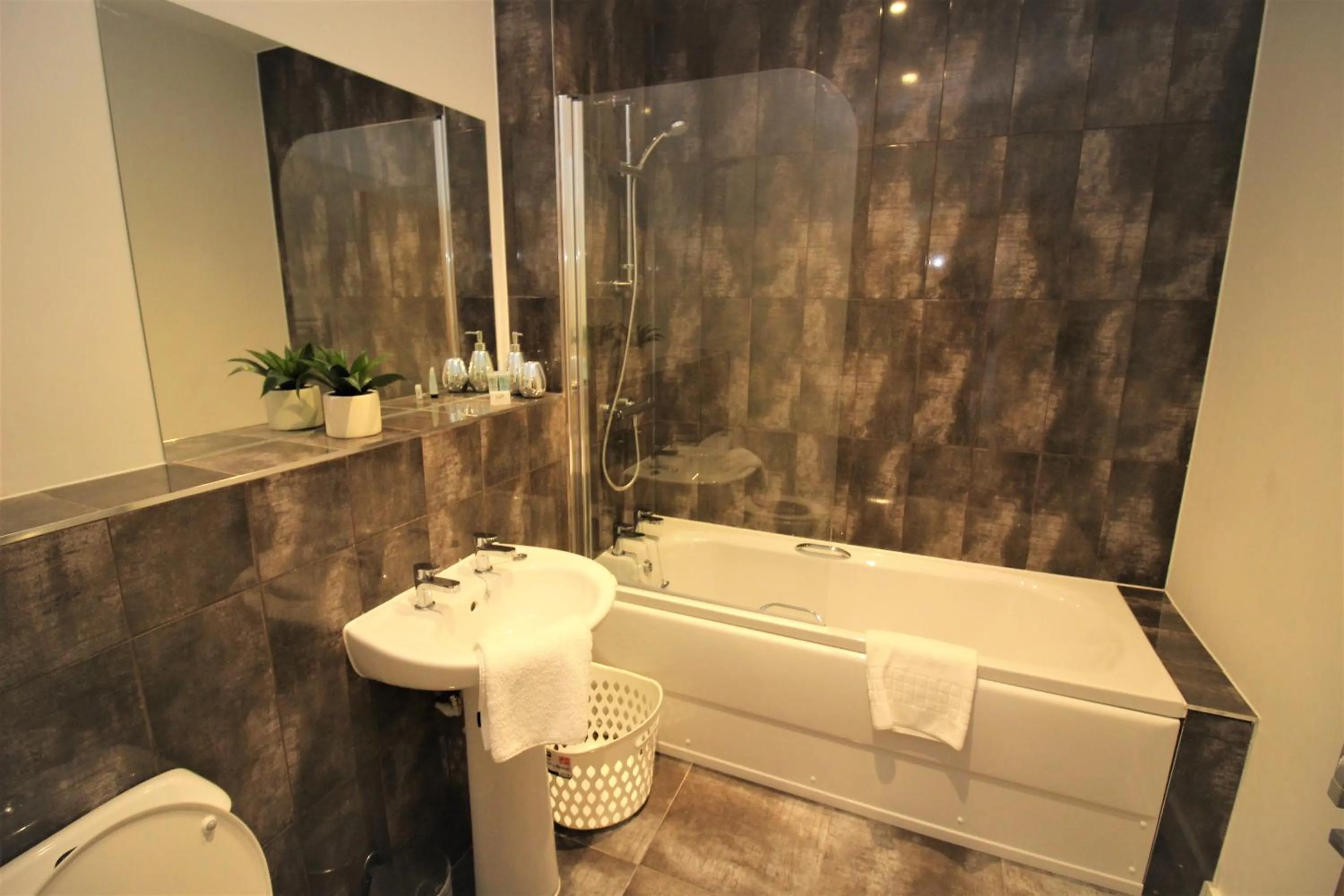 Bathroom in City Suites by Guestz