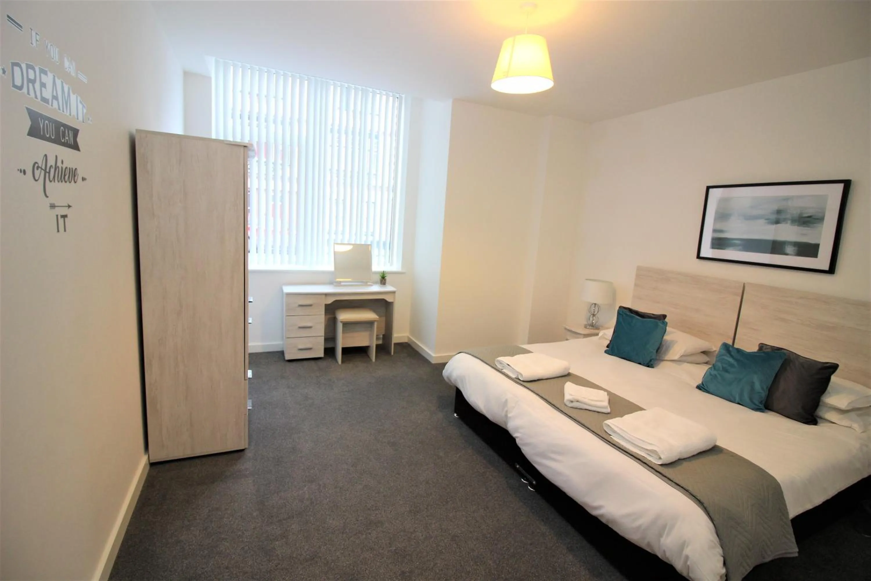 Photo of the whole room, Bed in City Suites by Guestz