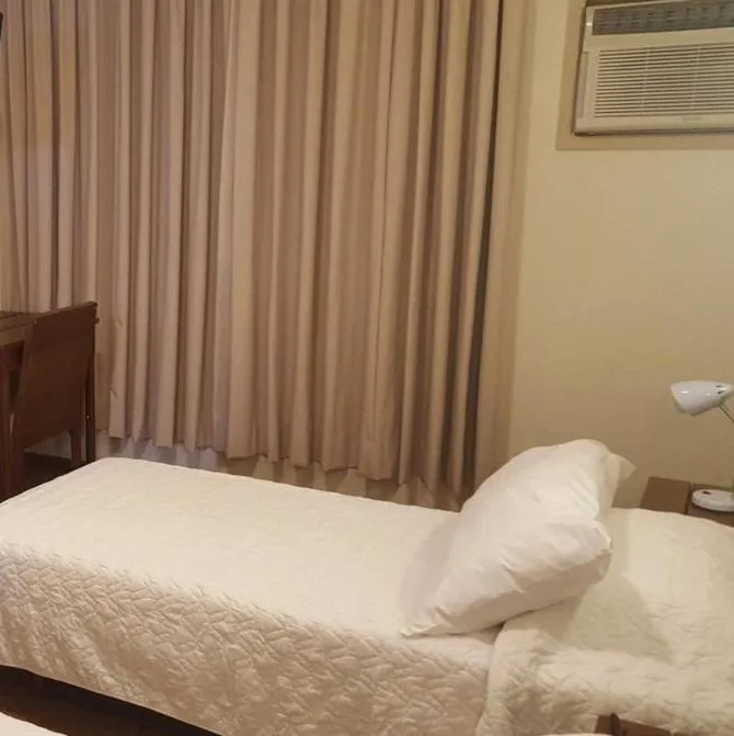 Bed in Niteroi Palace Hotel