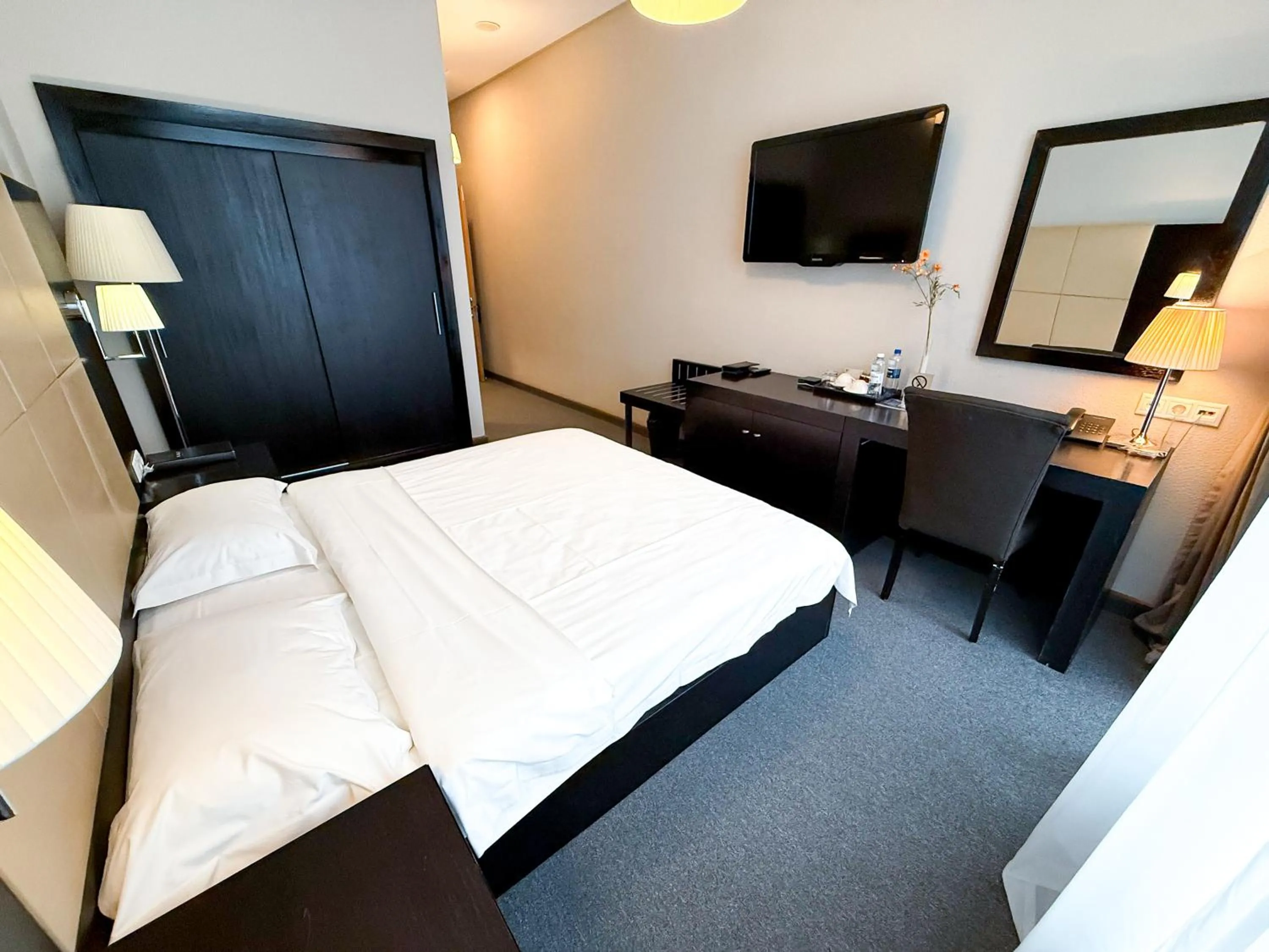 Bed in Voyage Hotel