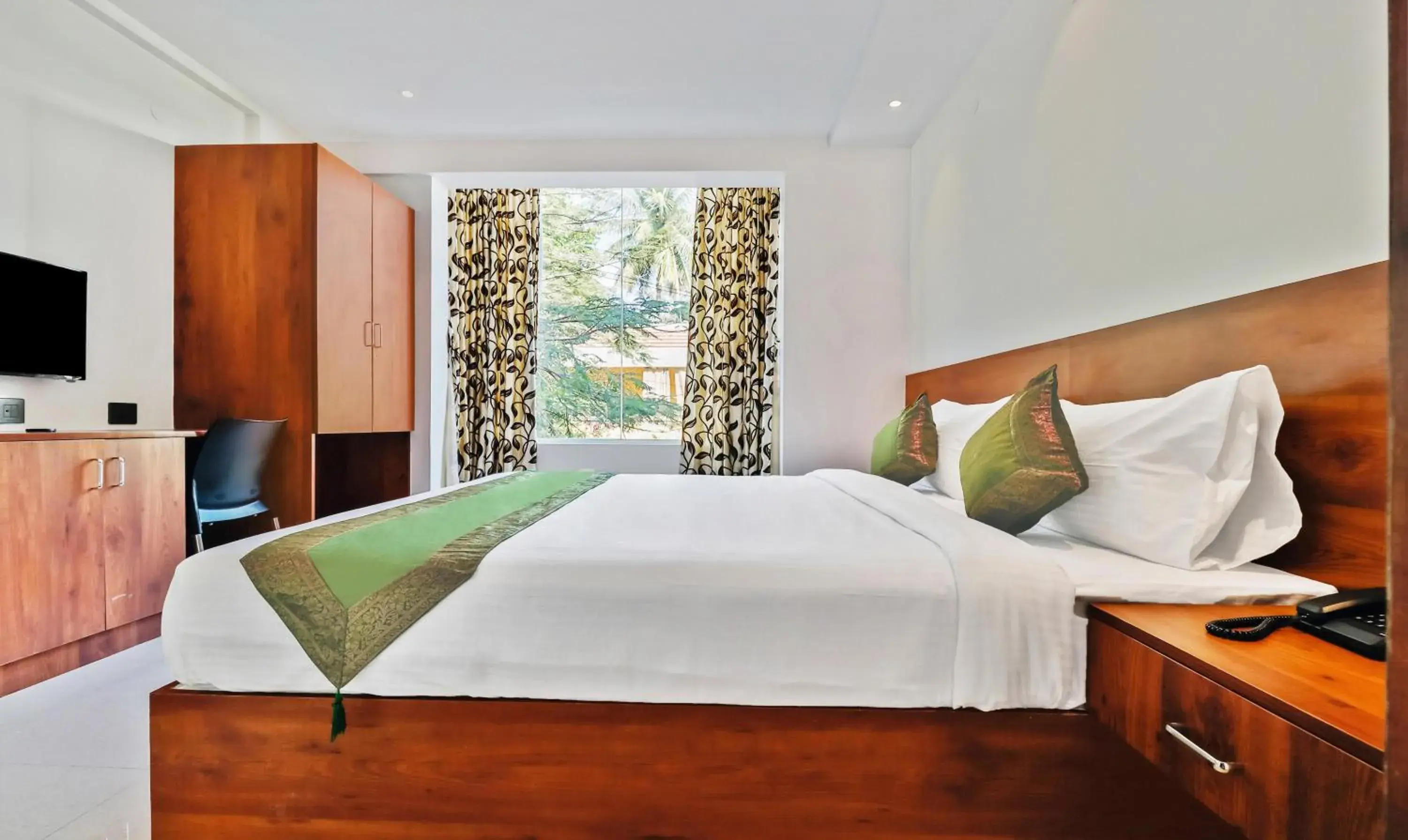 Photo of the whole room, Bed in Treebo Blu Orchid Photo of the whole room, Bed in Treebo Blu Orchid