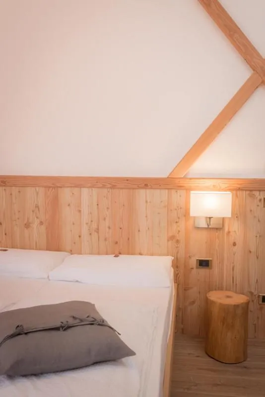 Bed in Garni Le Prealpi