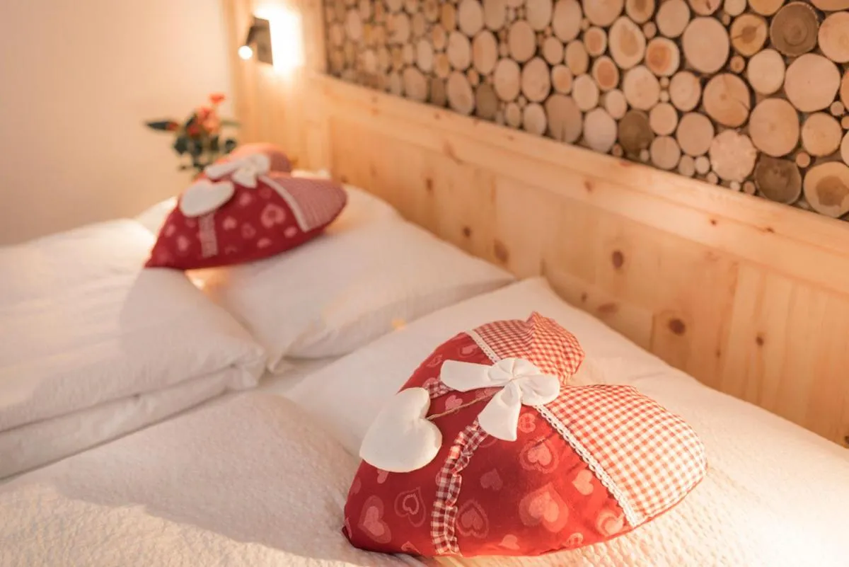 Bed in Garni Le Prealpi