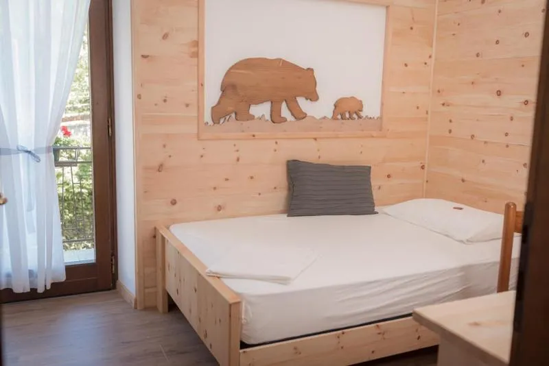 Bed in Garni Le Prealpi