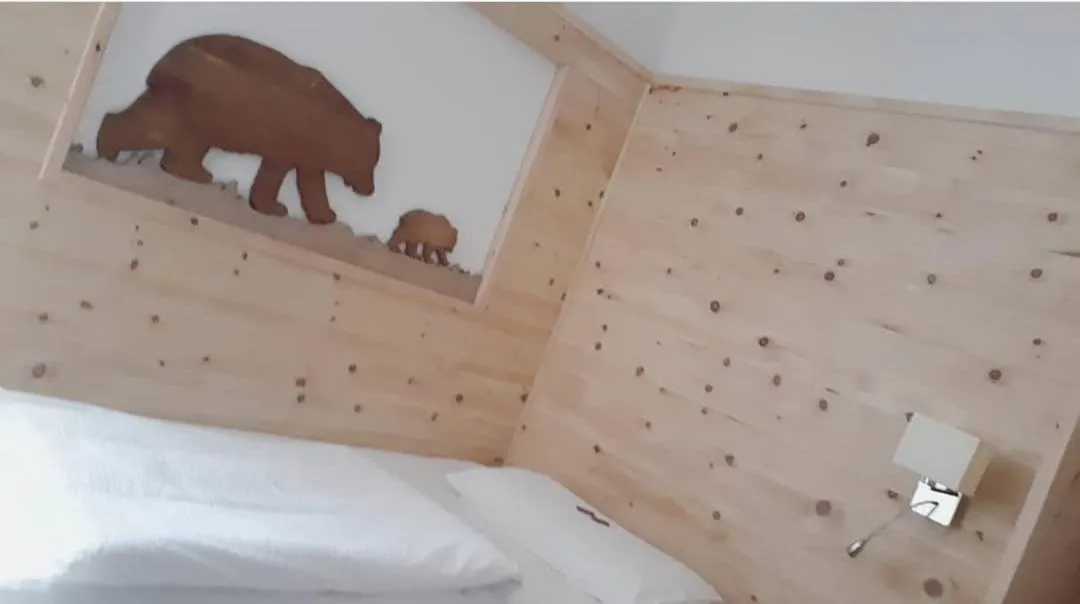 Bed in Garni Le Prealpi