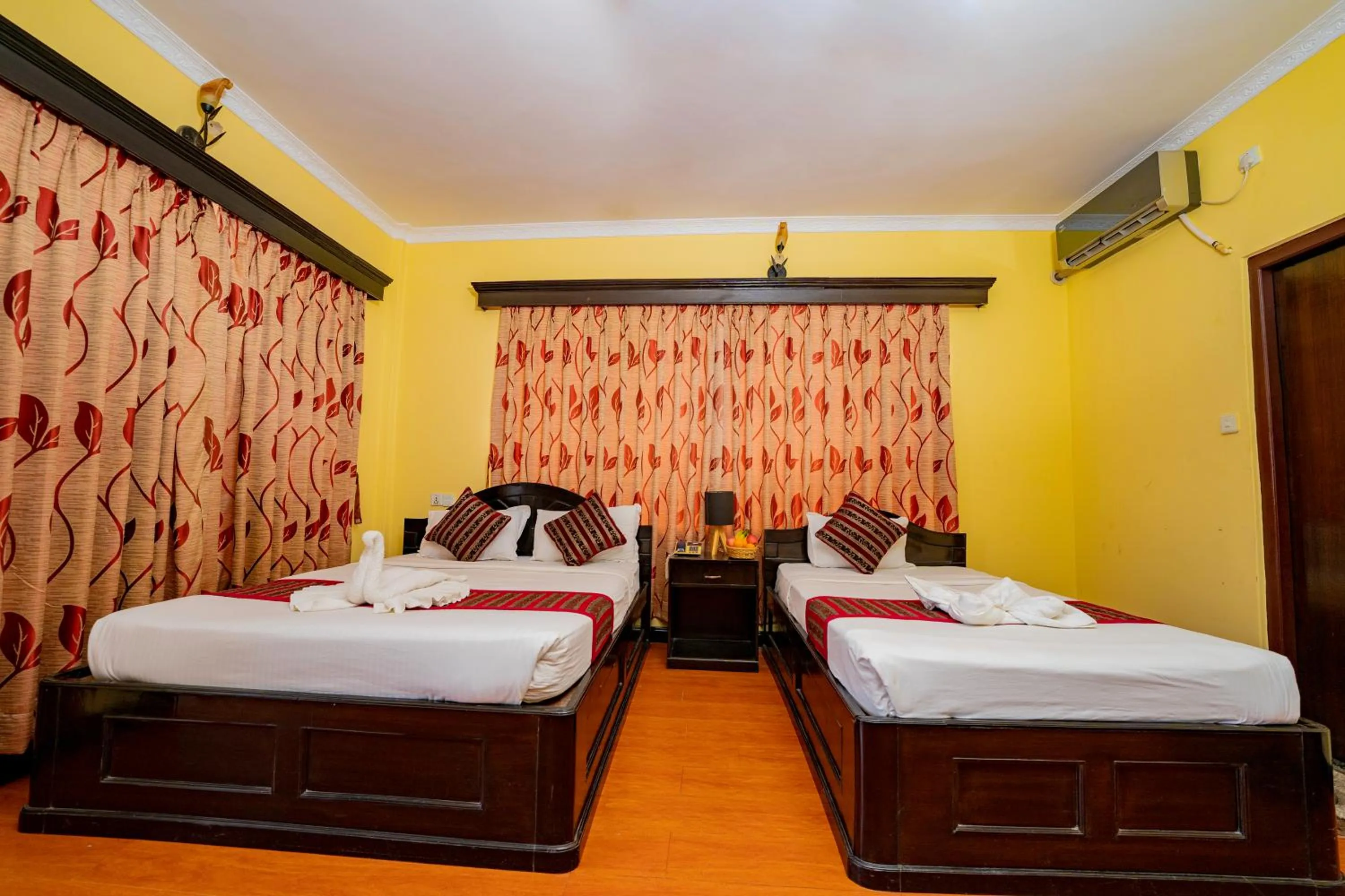 Bed in Hotel Bougainvillea